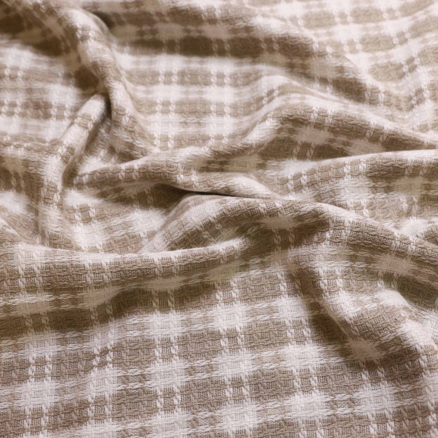 beige and white wool blend boucle dressmaking fabric with check pattern