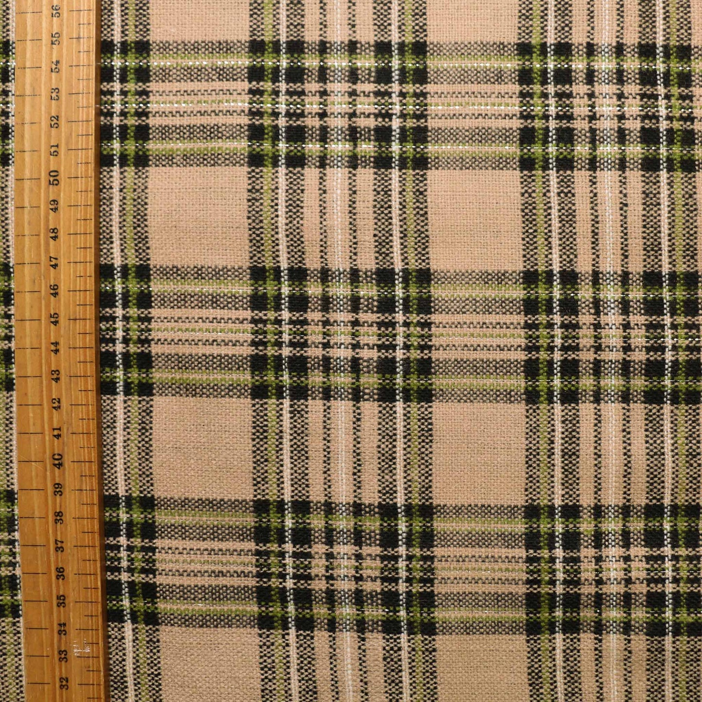 metre wool blend suiting dressmaking fabric with black and khaki check pattern on beige