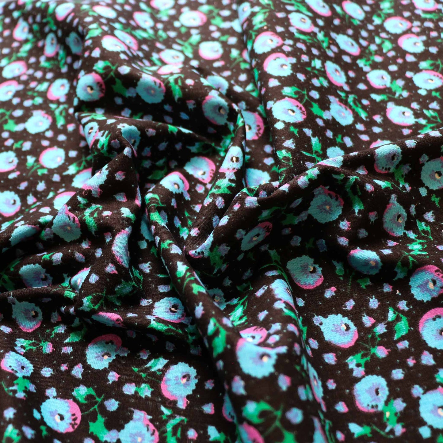 folded black vintage cotton poplin deadstock sustainable fabric with printed floral pattern