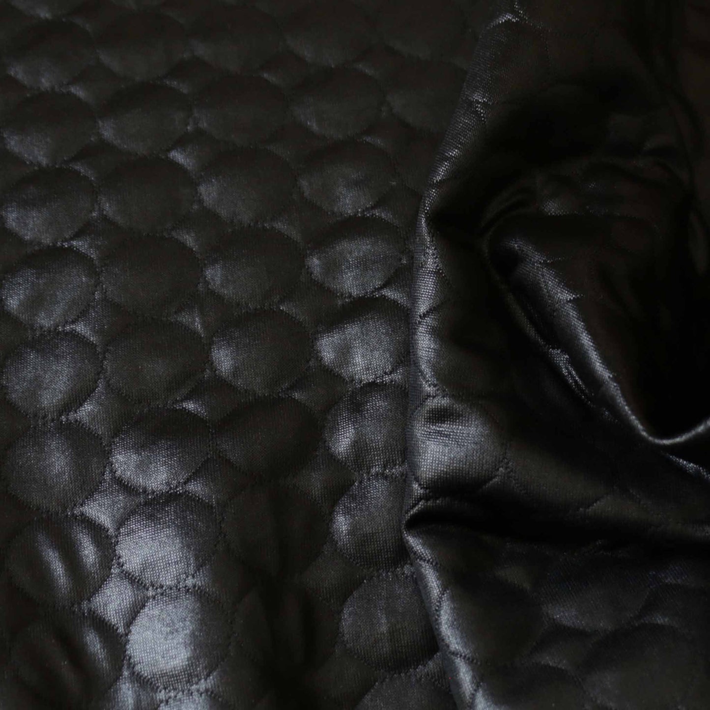 jersey quilting dressmaking fabric with glossy texture and circle design