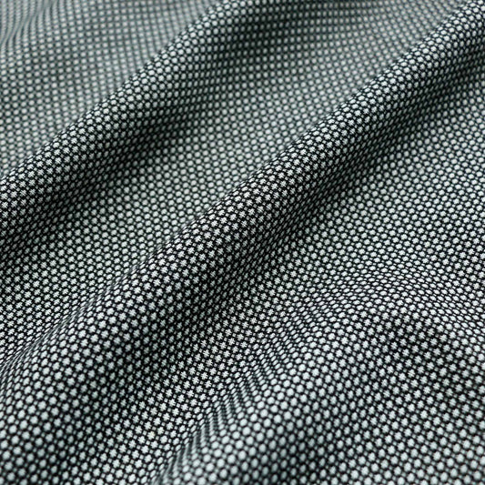 polyviscose black suiting dressmaking fabric with jacquard polka dot design in white
