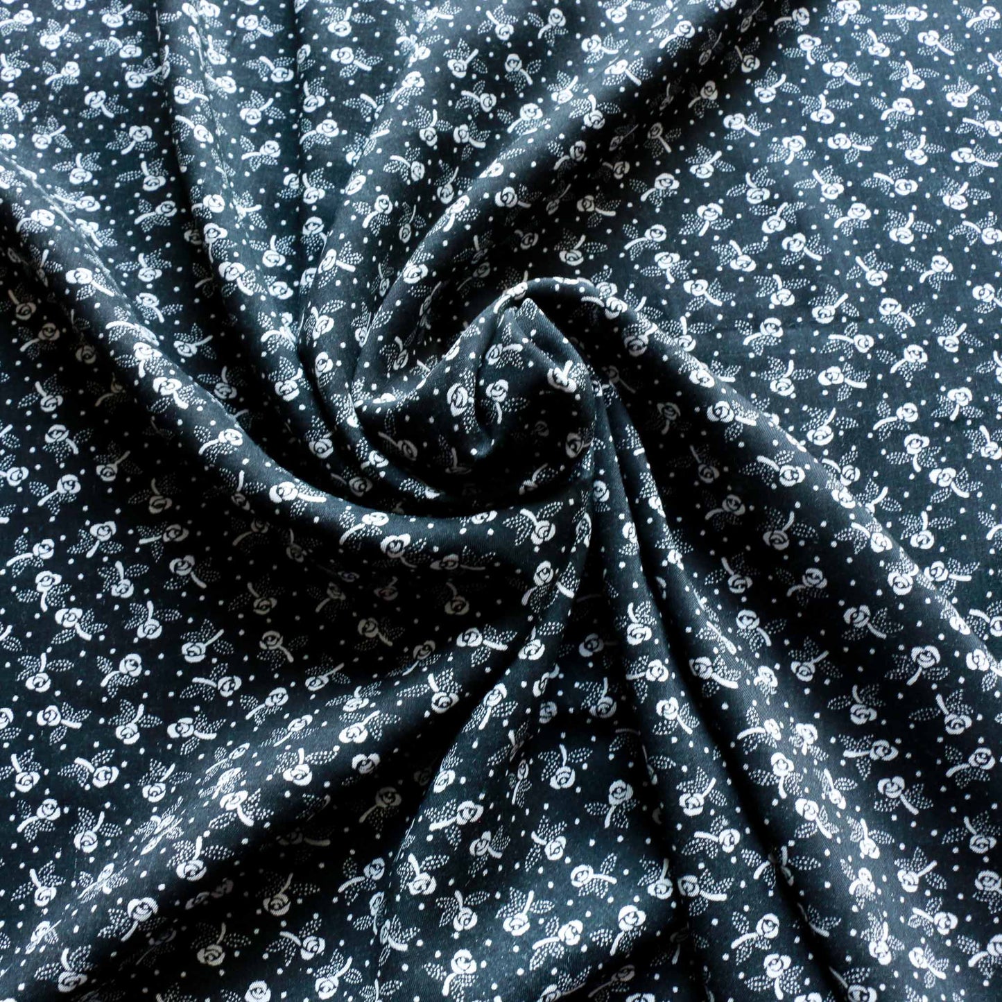 black and white viscose rayon dressmaking voile fabric with rose print design