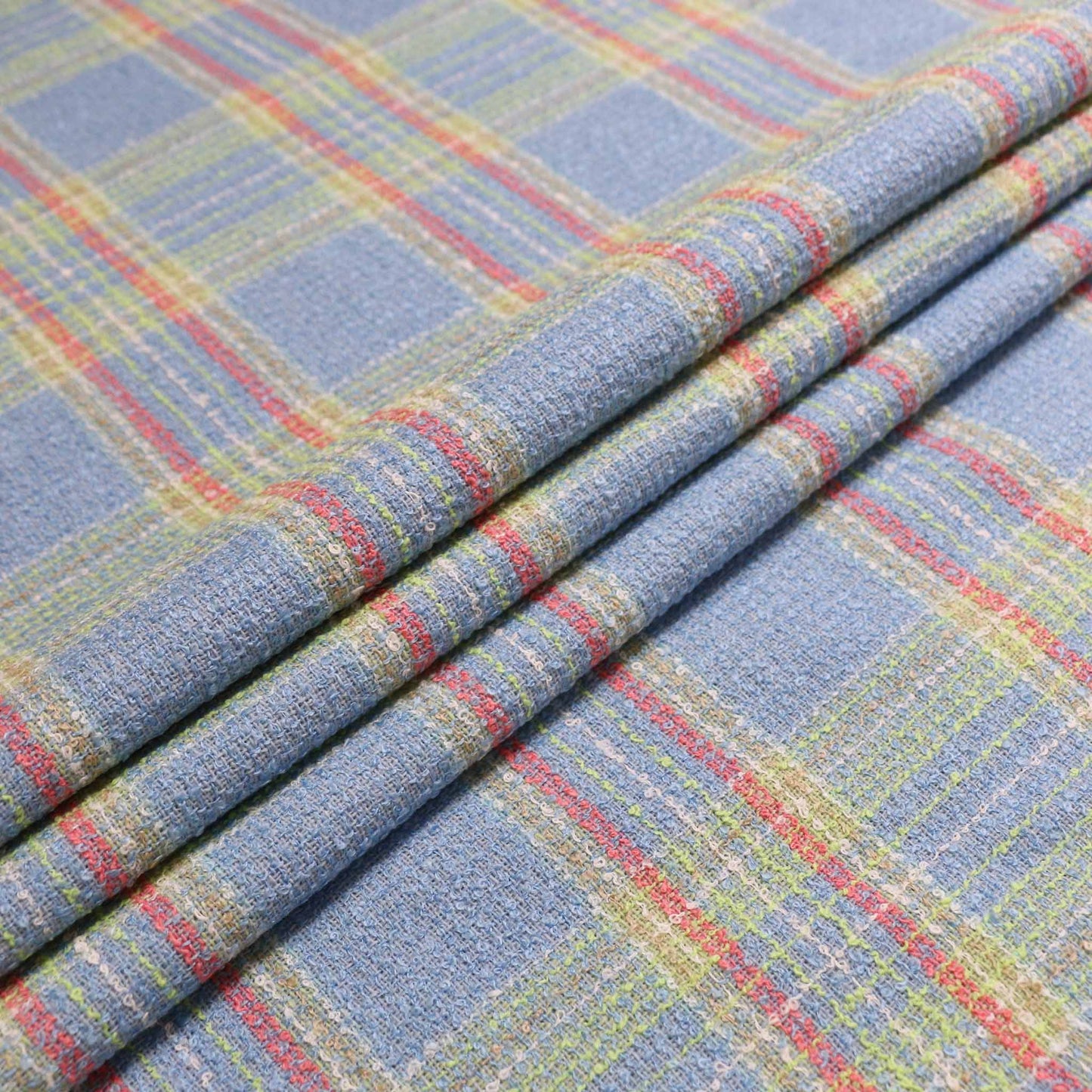 pale blue wool blend boucle dressmaking fabric with pink and lime green check pattern