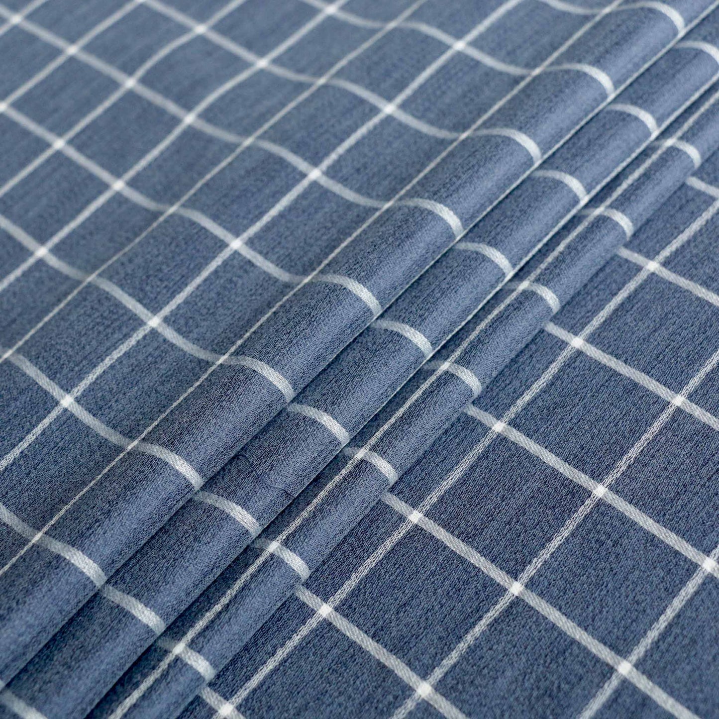 blue viscose rayon dressmaking fabric with white check pattern