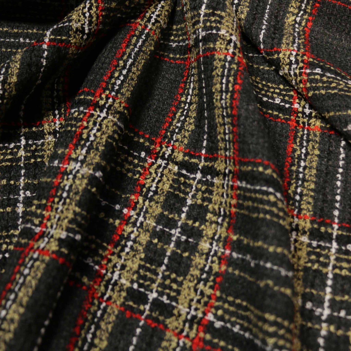 wool blend dark grey boucle dressmaking fabric with check pattern