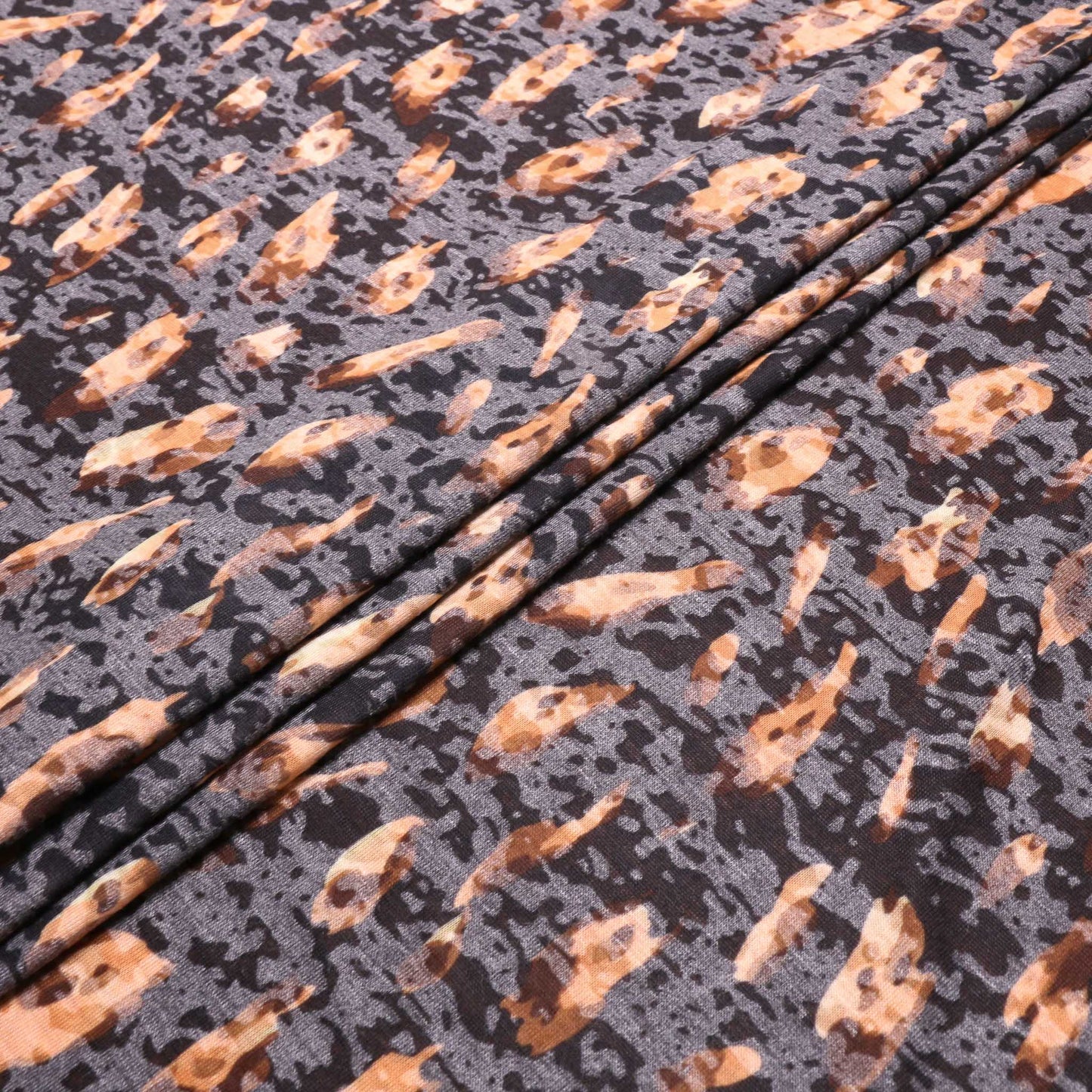 folded jersey knit dress fabric with animal print in brown and beige