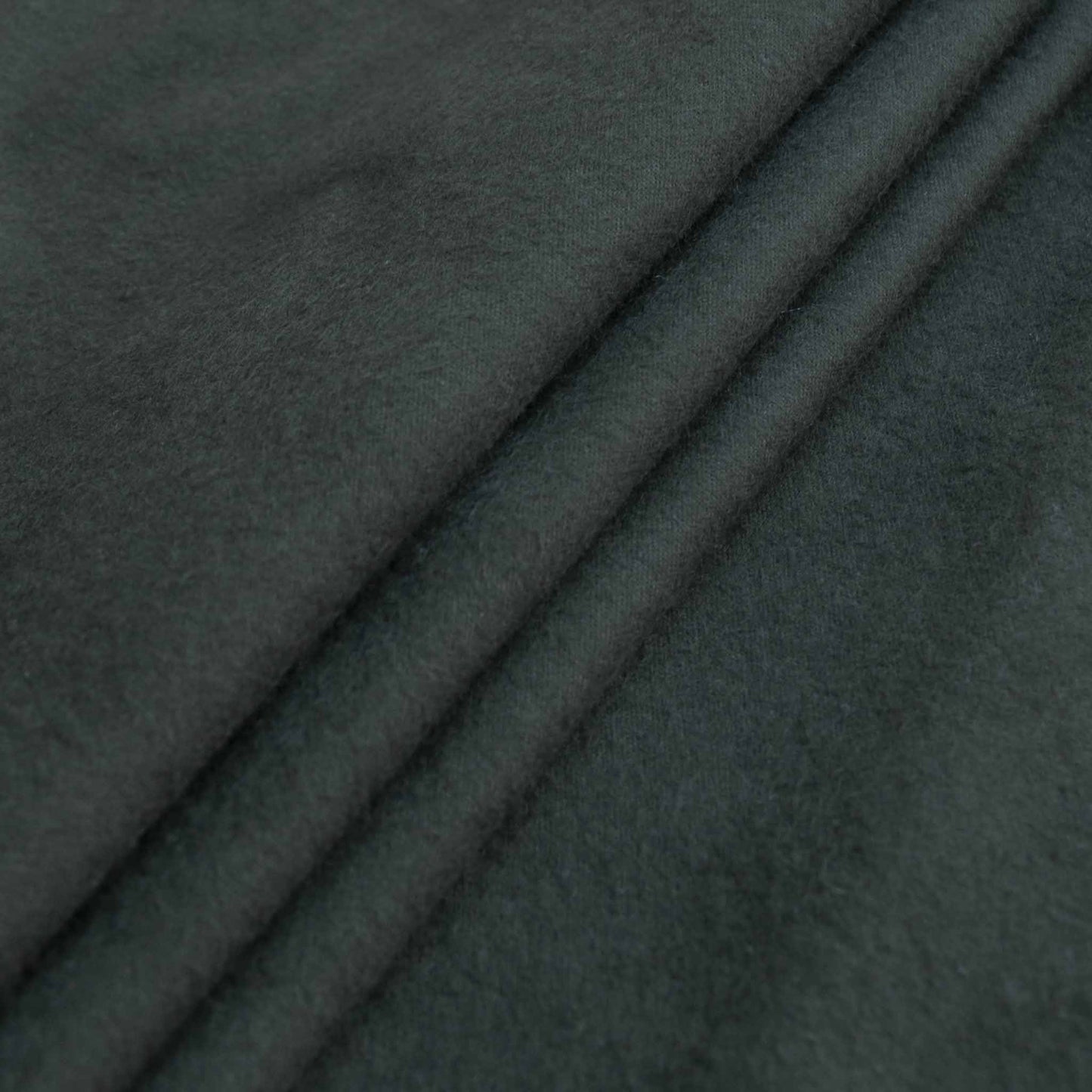 folded khaki green brushed cotton dressmaking fabric