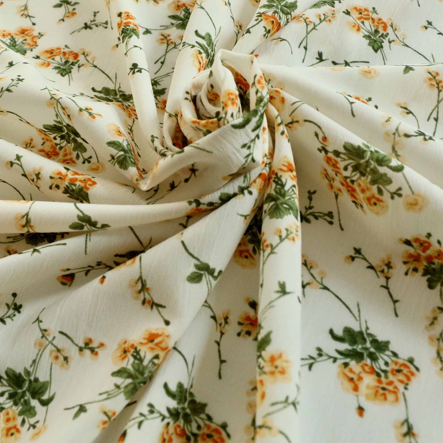 cream floral printed chiffon polyester dressmaking fabric with delicate flower design