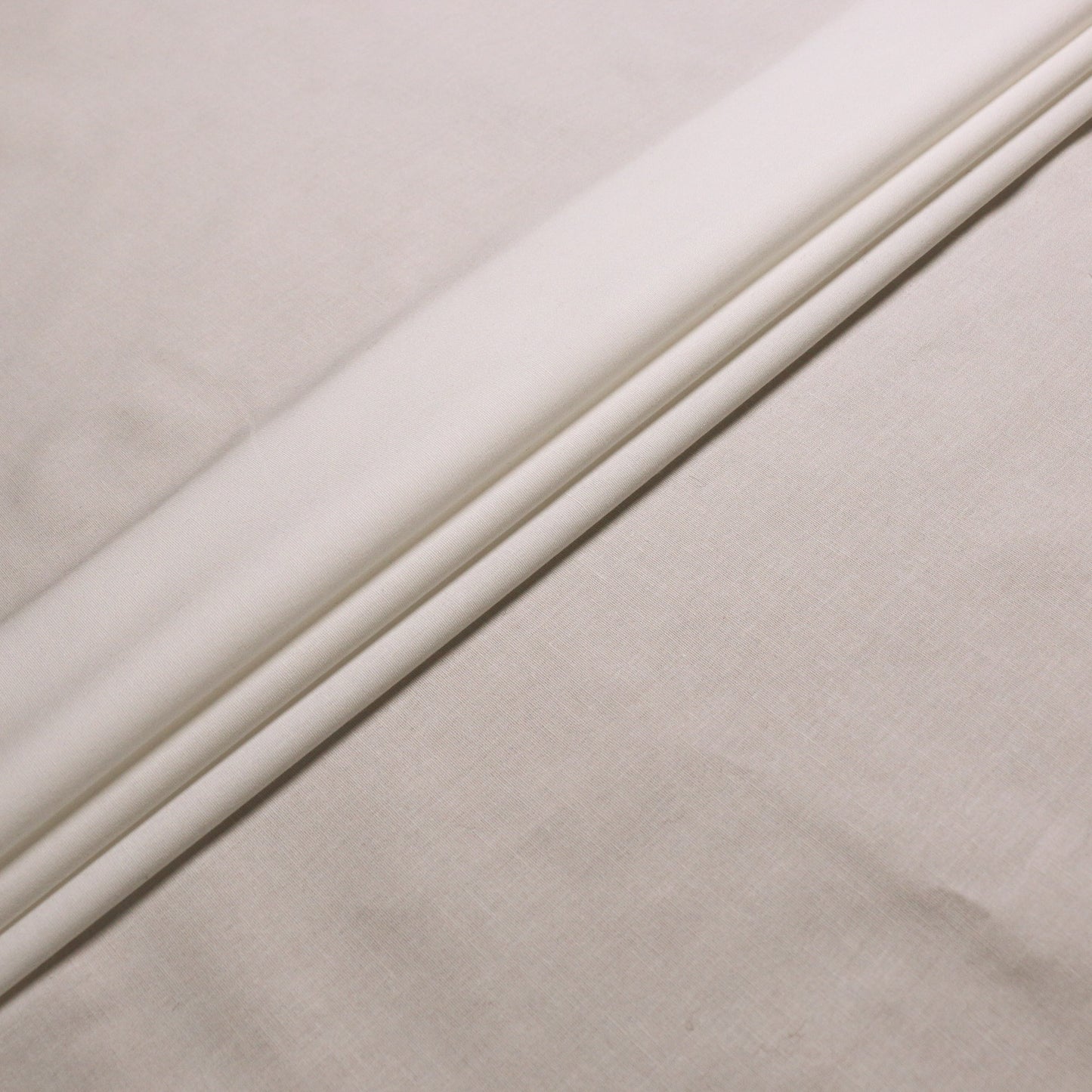 plain cream stretchy cotton dressmaking fabric