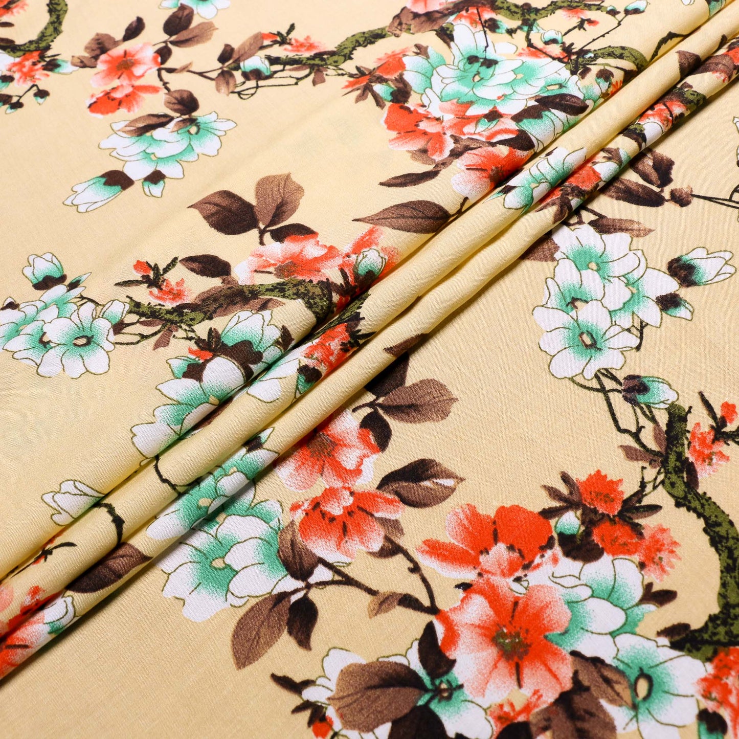 dark vanilla viscose fabric with a blood orange and green Japanese flower