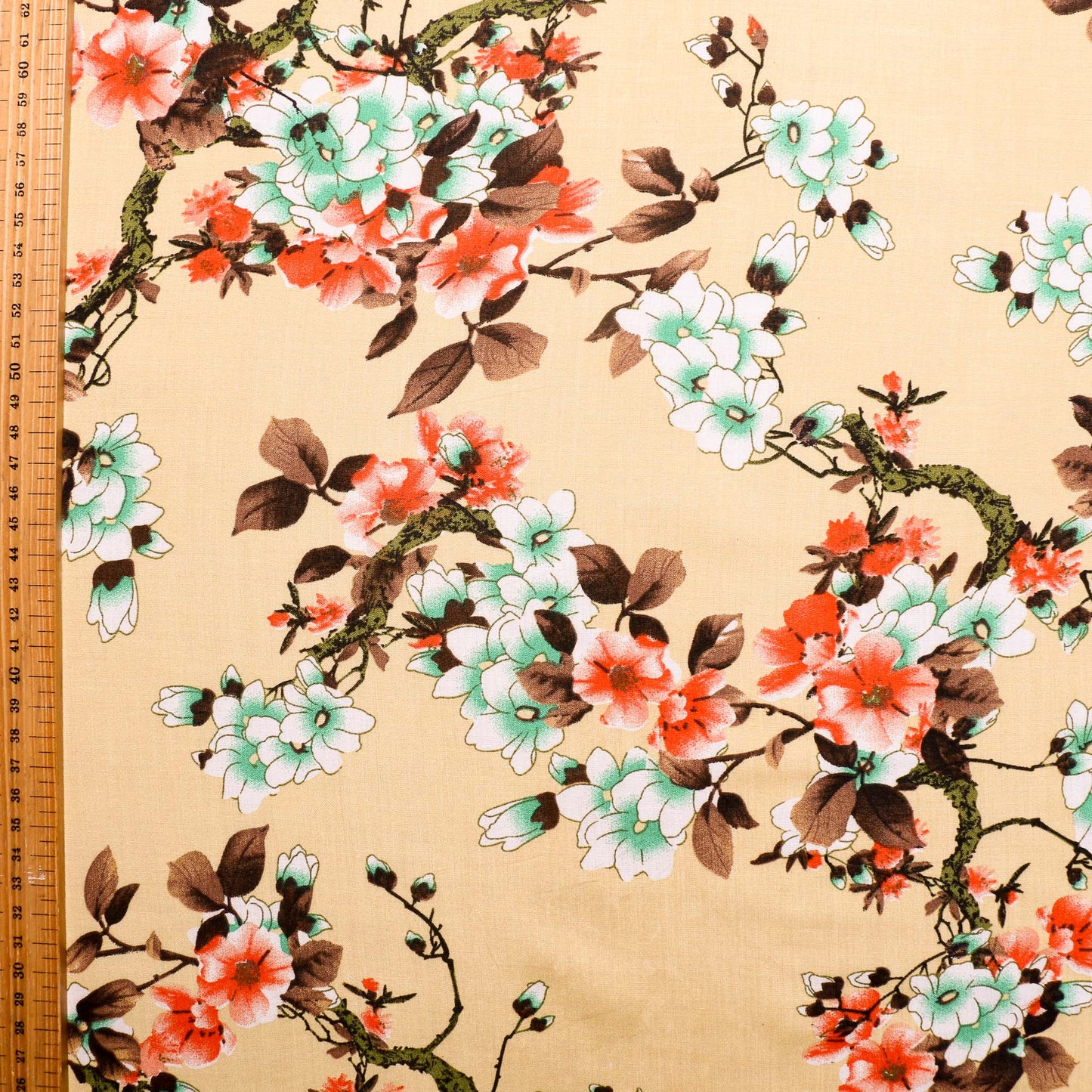 Japanese flower on dark vanilla viscose with tape measure