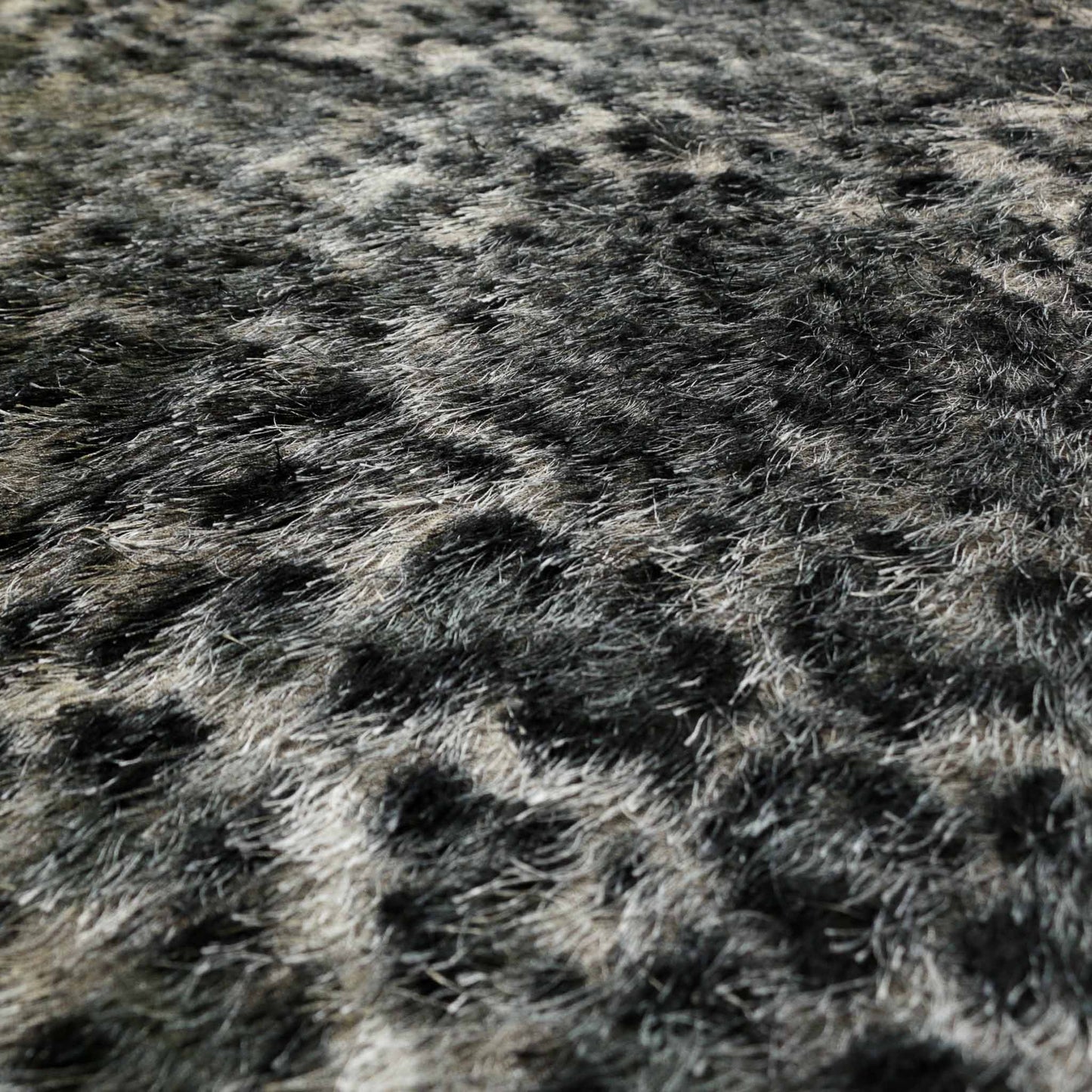 grey and black eyelash dressmaking fabric with jaguar print animal skin design print
