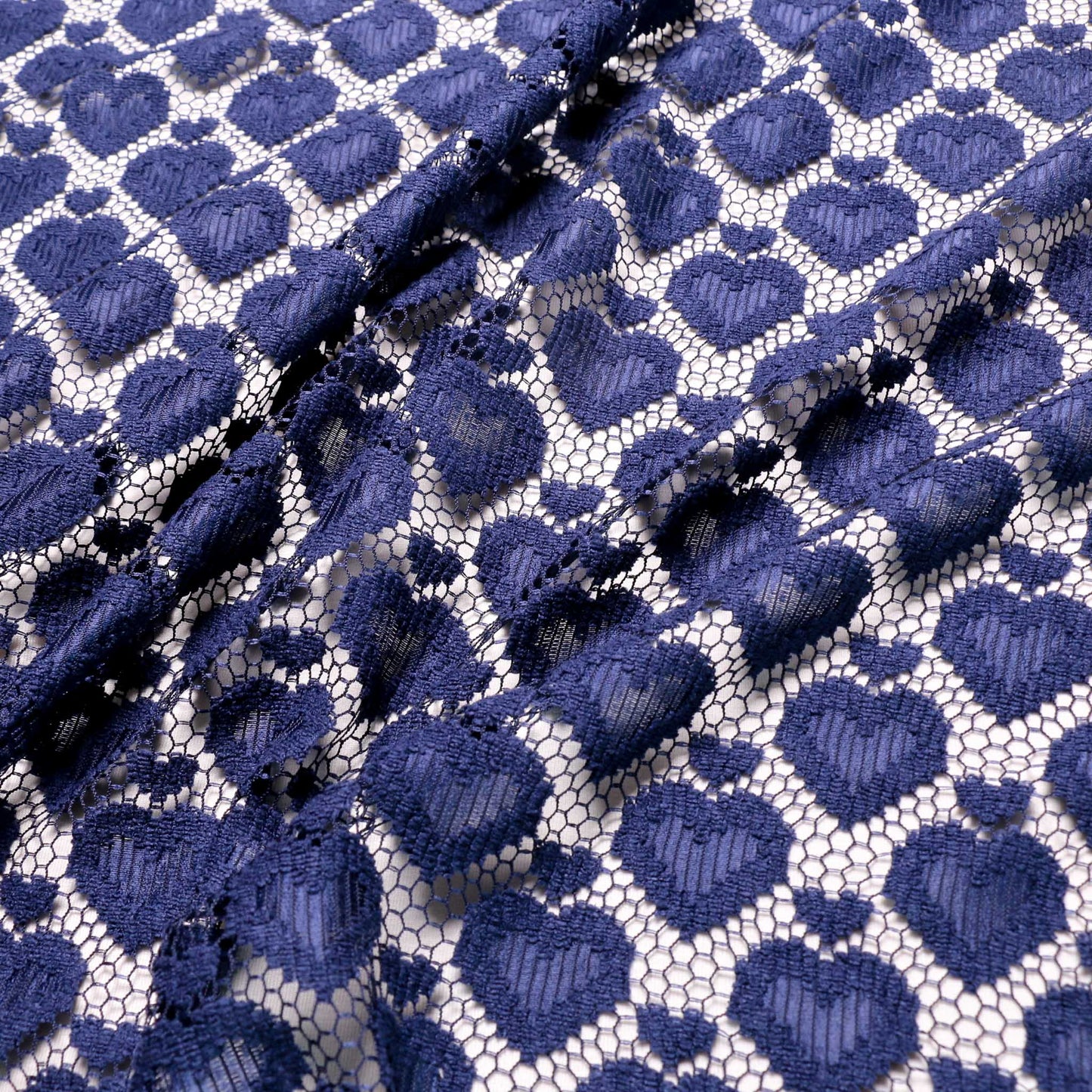 love heart patterned blue lace dressmaking fabric