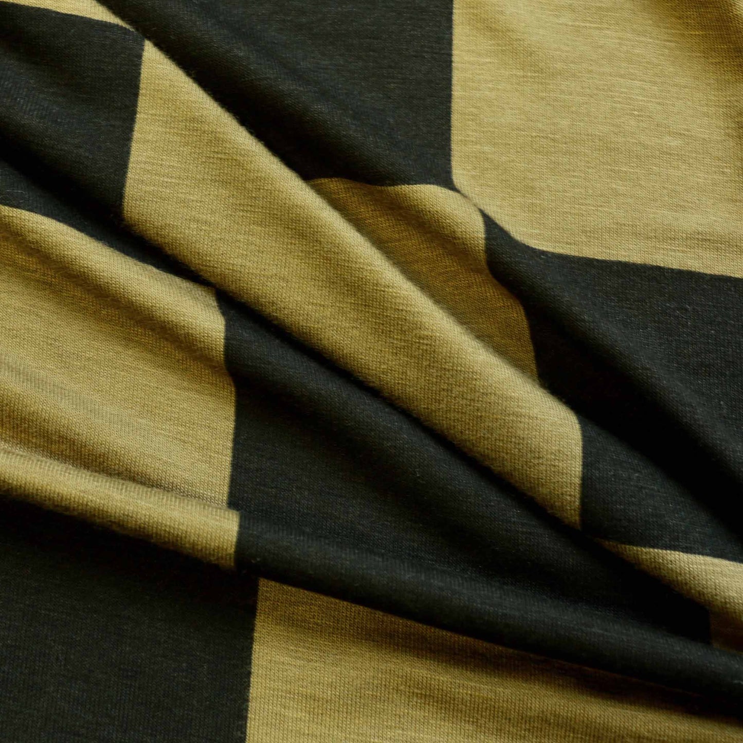 khaki green and black check pattern jersey viscose dressmaking fabric