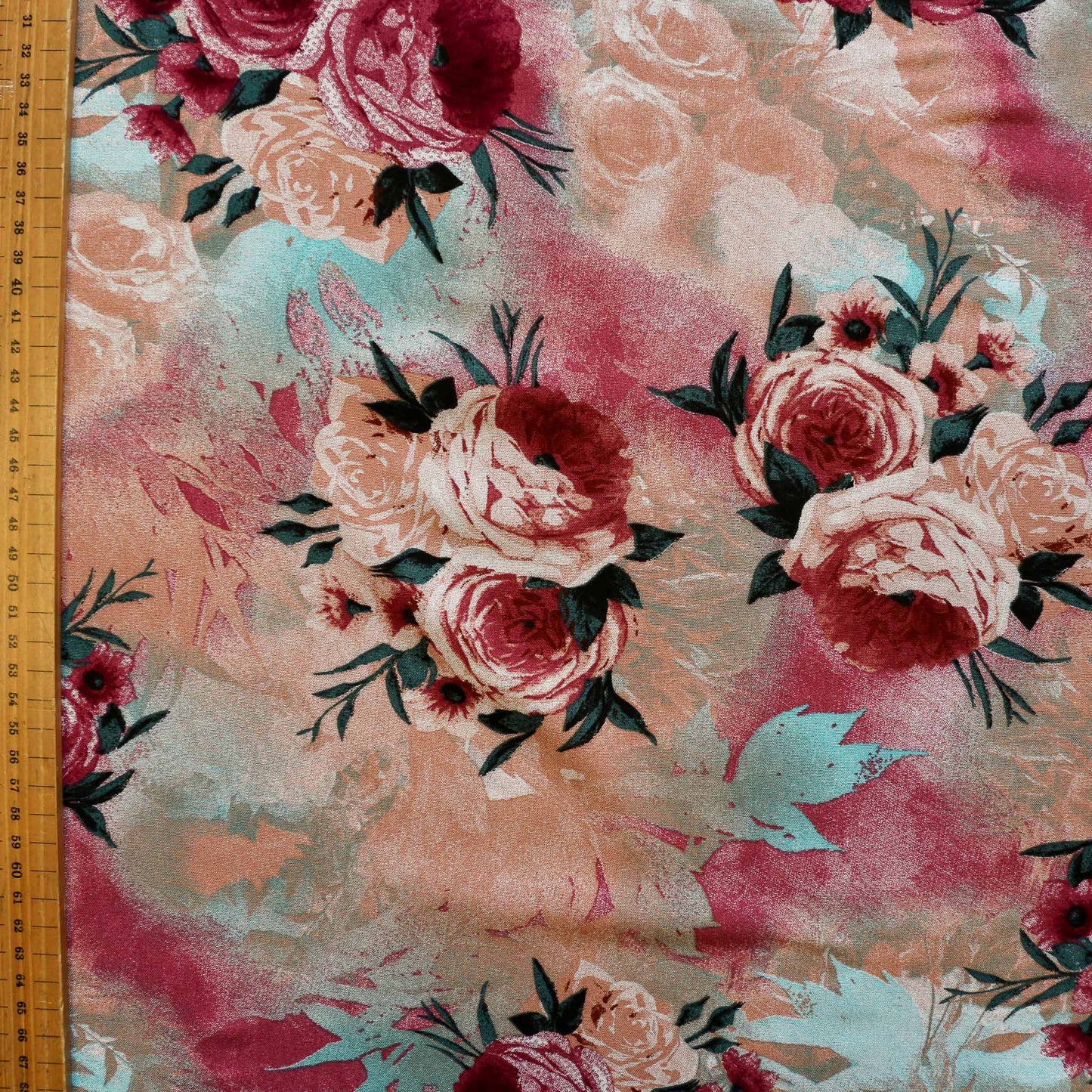 metre light beige viscose challis dressmaking fabric with maroon and pastel floral print