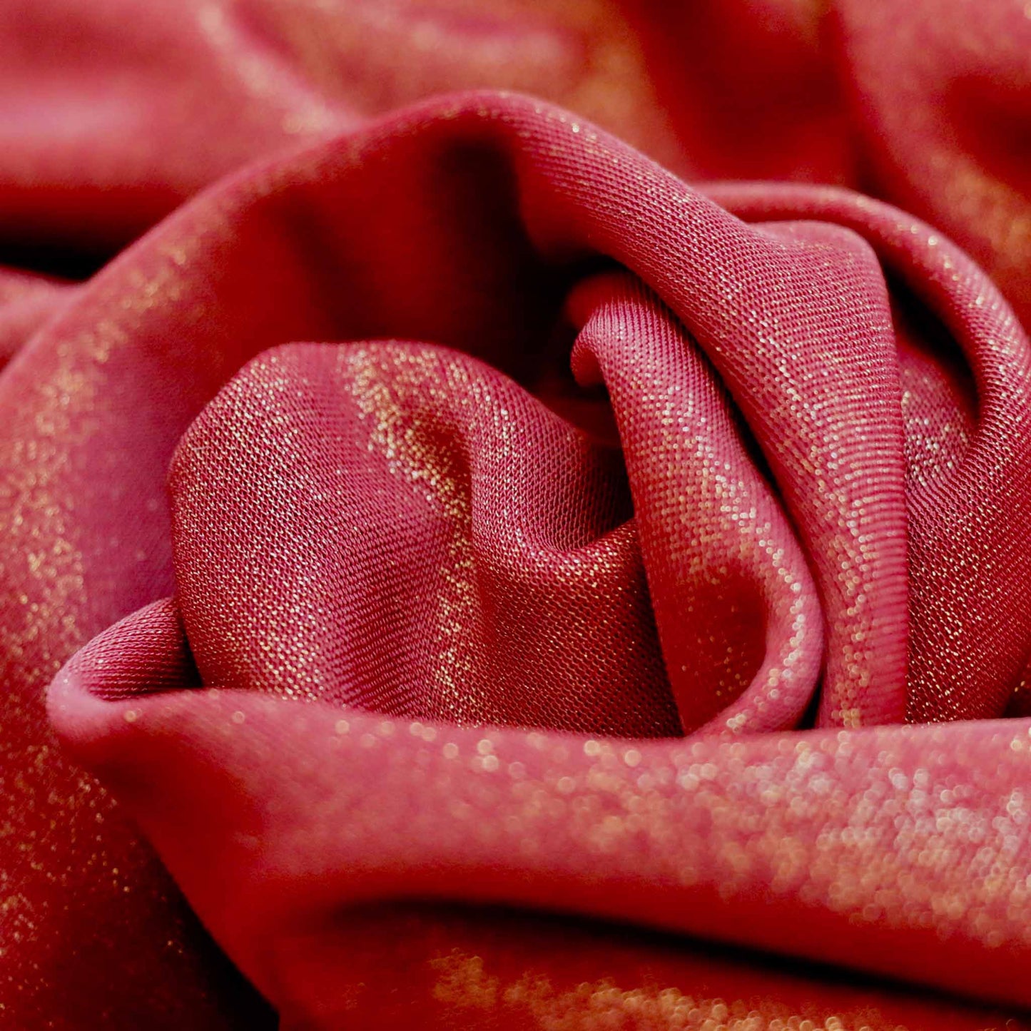 gold shimmer lycra dressmaking fabric in maroon colour