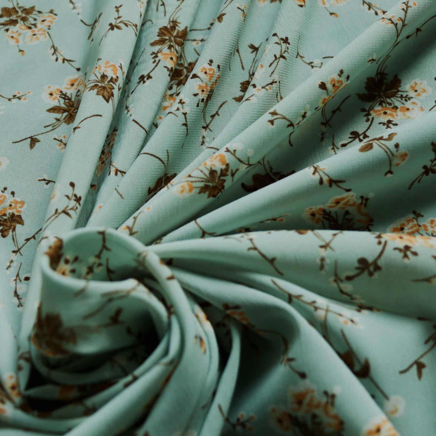 duck egg green chiffon polyester dressmaking fabric with brown and beige printed flowers