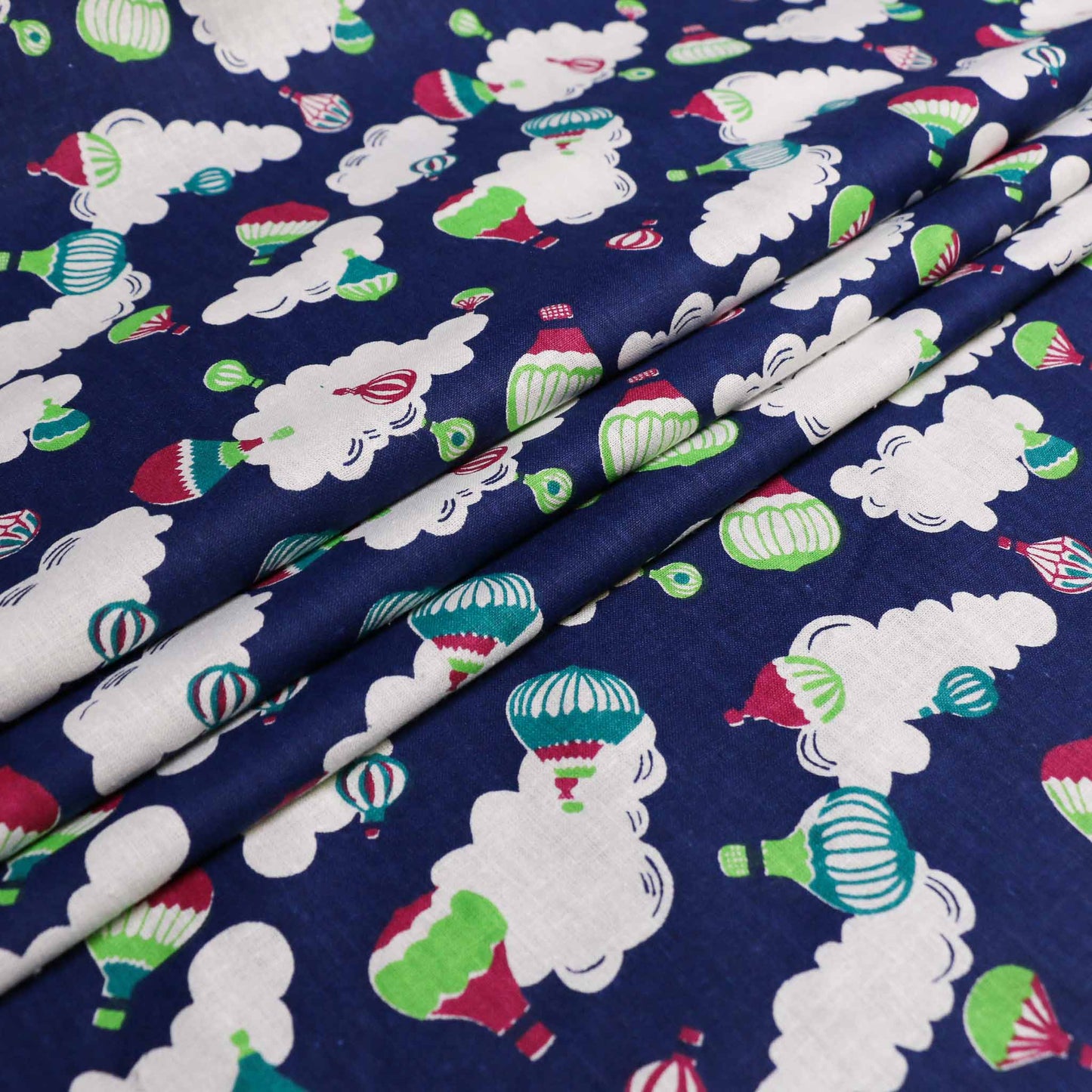 sustainable retro dark blue cotton poplin with hot air balloon clouds pattern