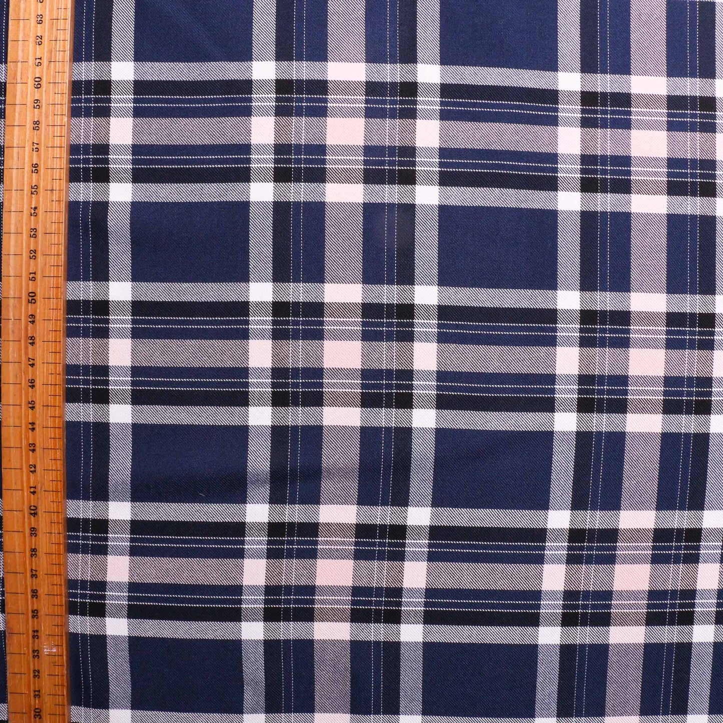 large white pink check design on navy blue viscose twill dressmaking rayon fabric