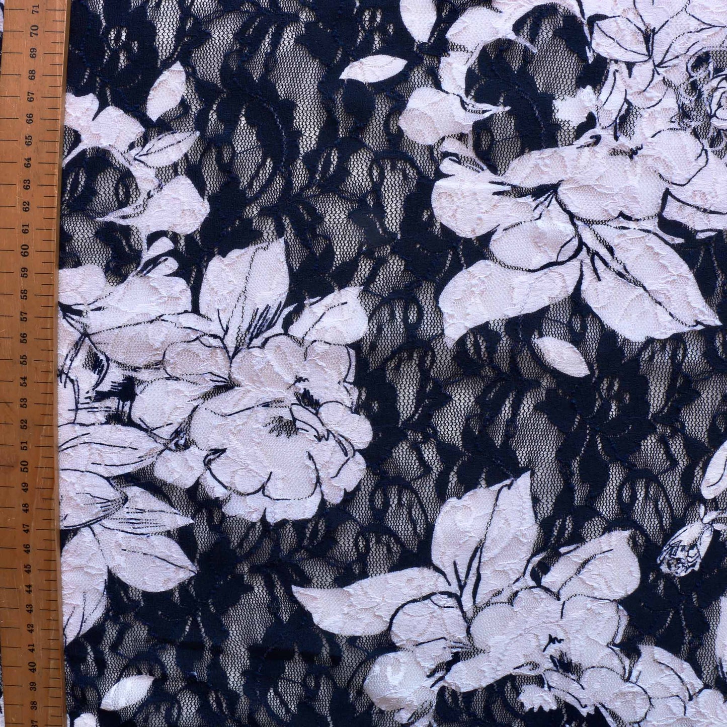 metre navy blue dressmaking lace fabric with floral design in white