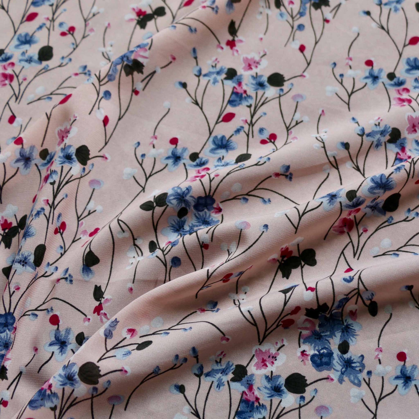 pink floral chiffon polyester dressmaking fabric with blue and purple flowers