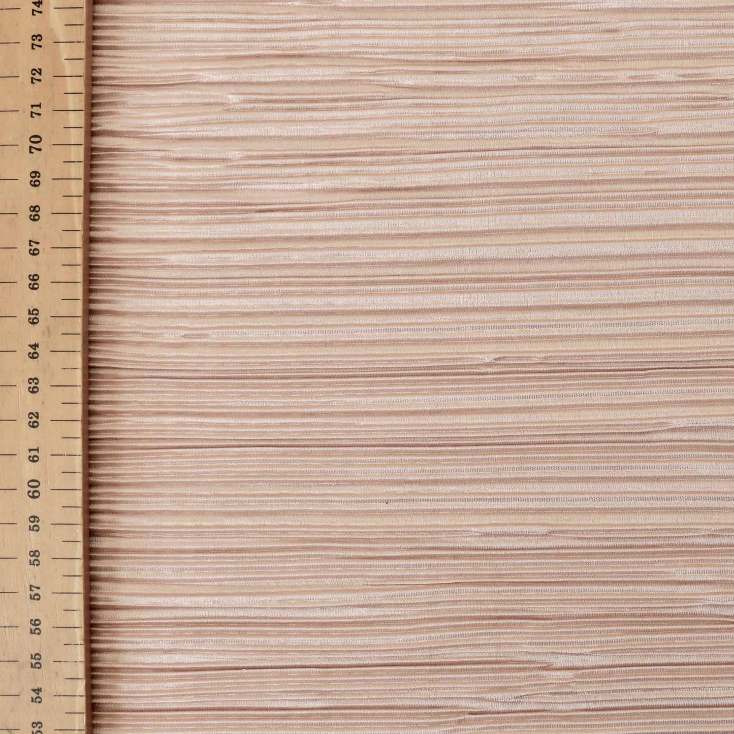 metre pink plisse dressmaking fabric with striped pattern