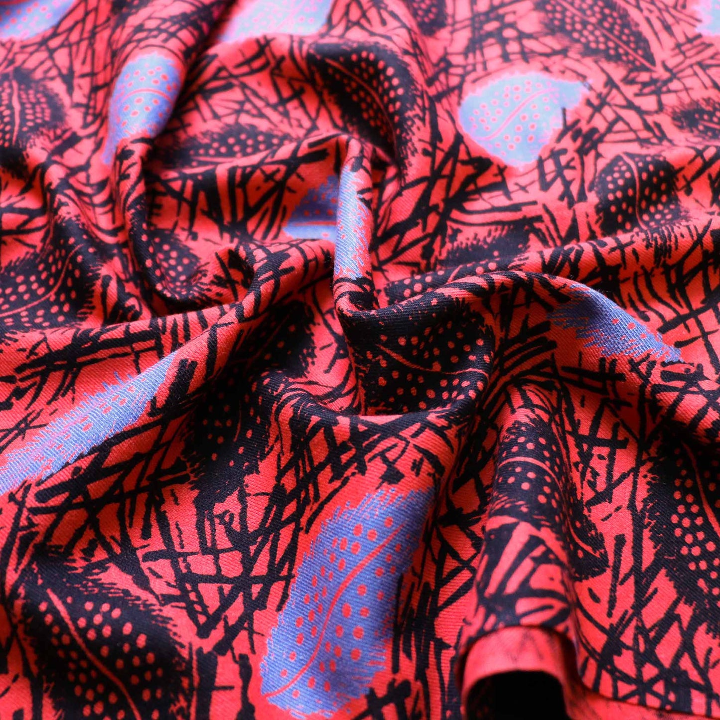 red vintage cotton twill sustainable dressmaking fabric with leaves print