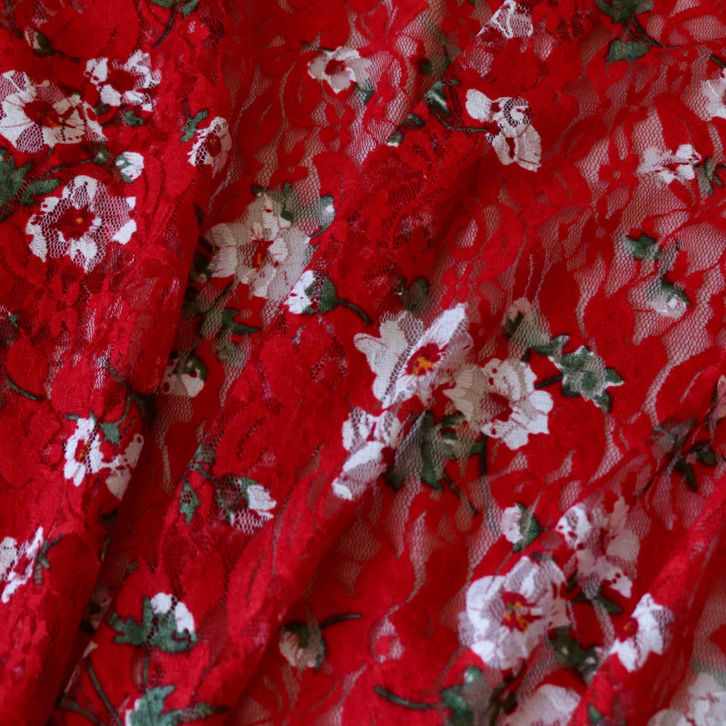 red dressmaking stretchy lace with white floral design