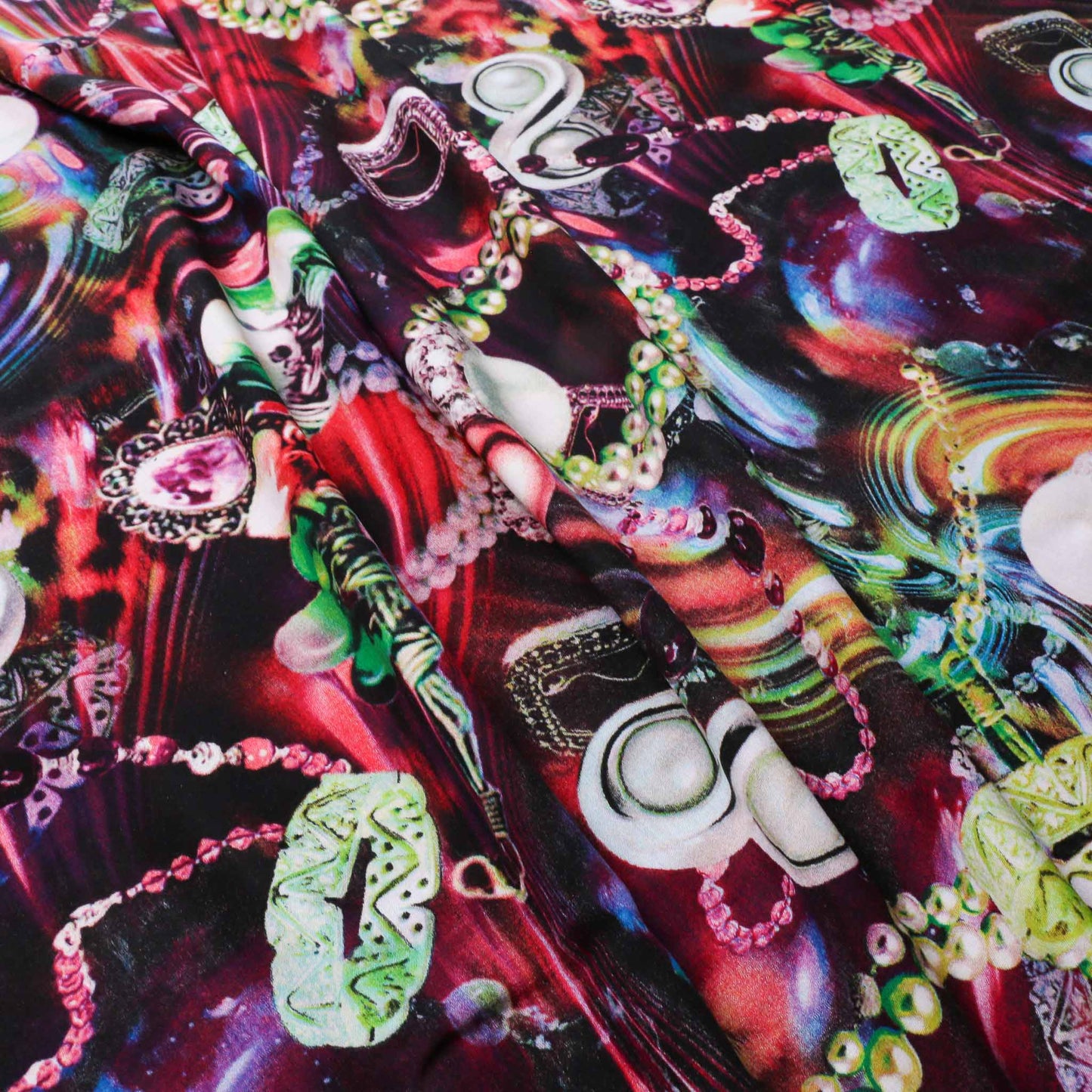 red pink viscose challis dressmaking rayon fabric with green and blue printed jewellery design