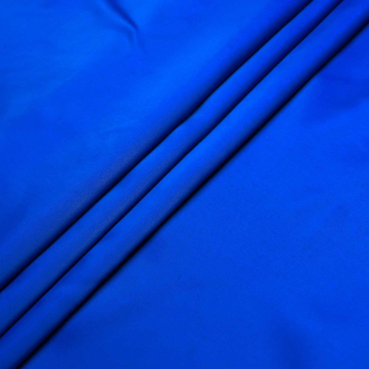stretchy dressmaking lining fabric in bright blue colour