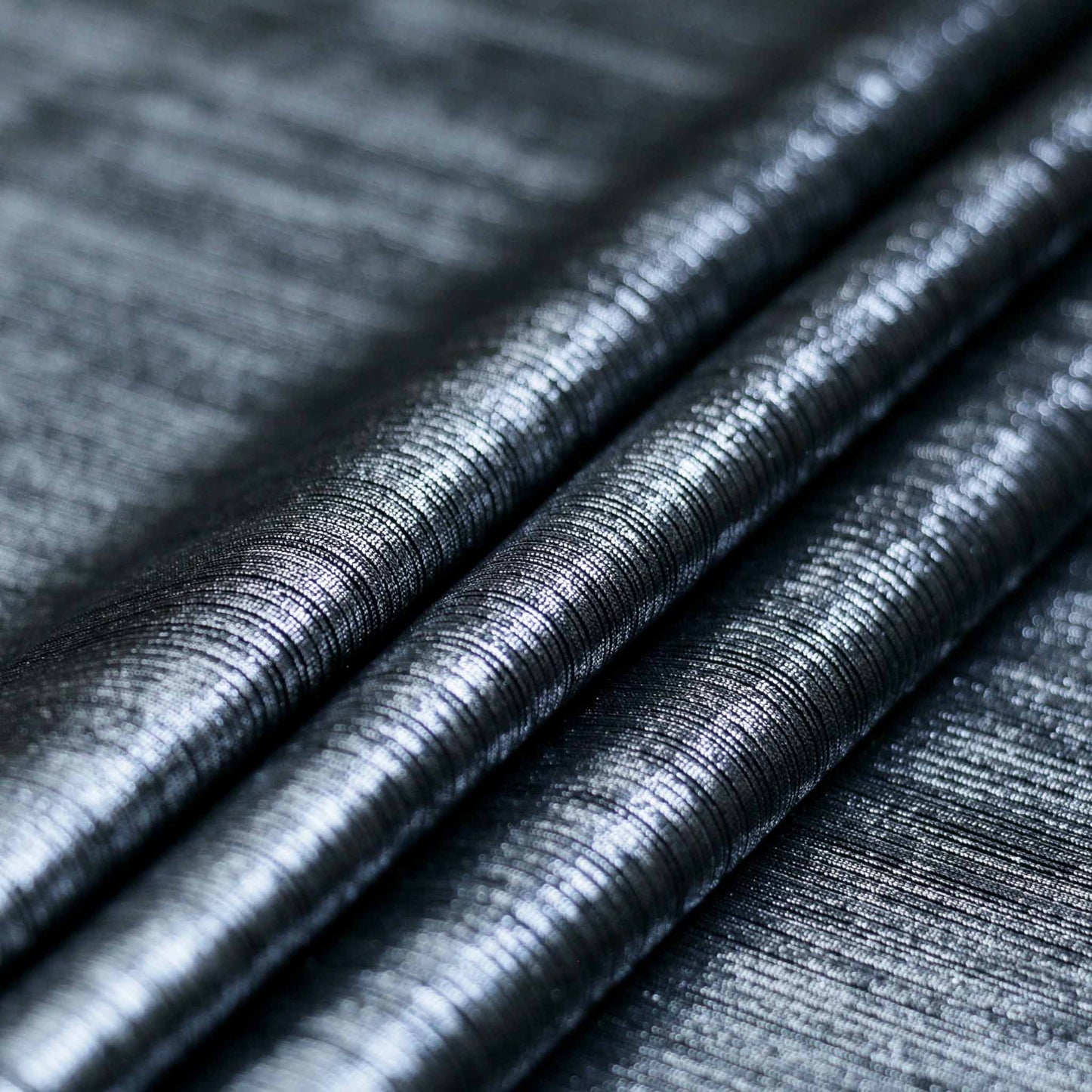 silver lycra metallic dressmaking fabric with striped shimmer design