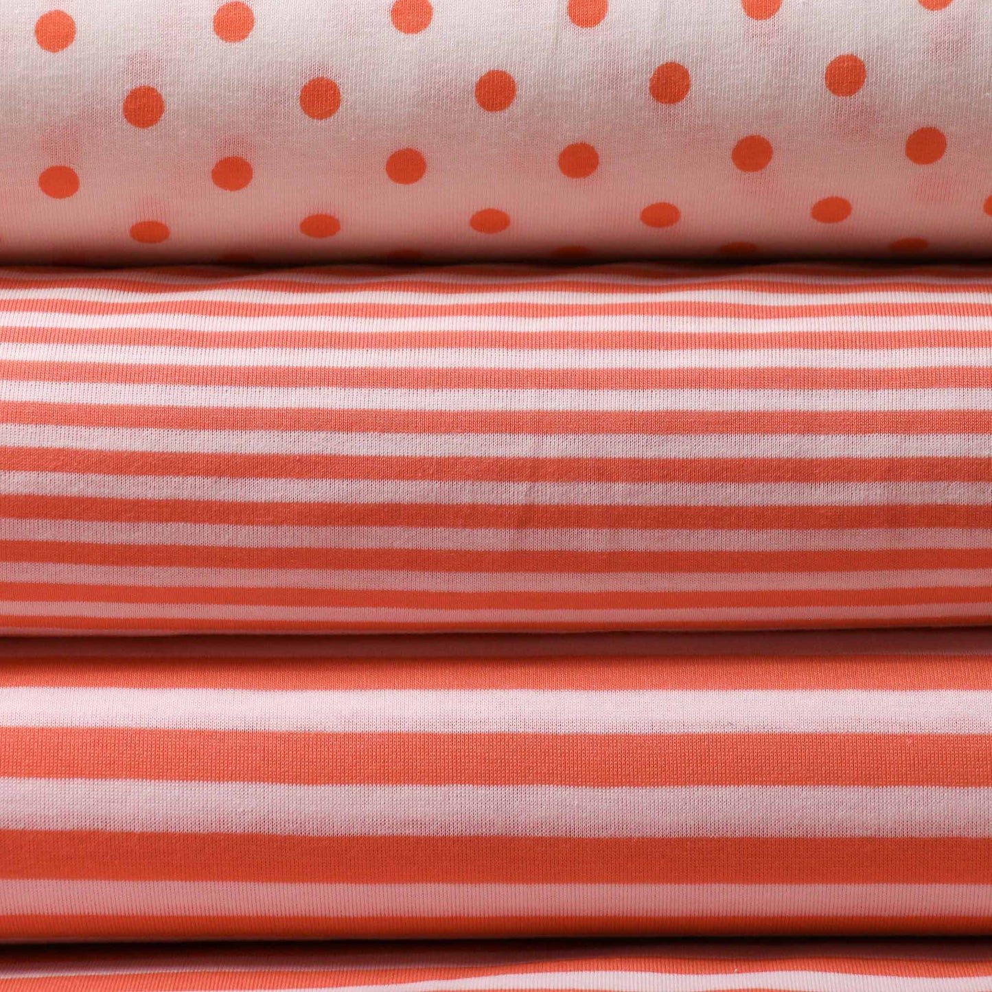striped polkadot white and orange jersey dressmaking fabric