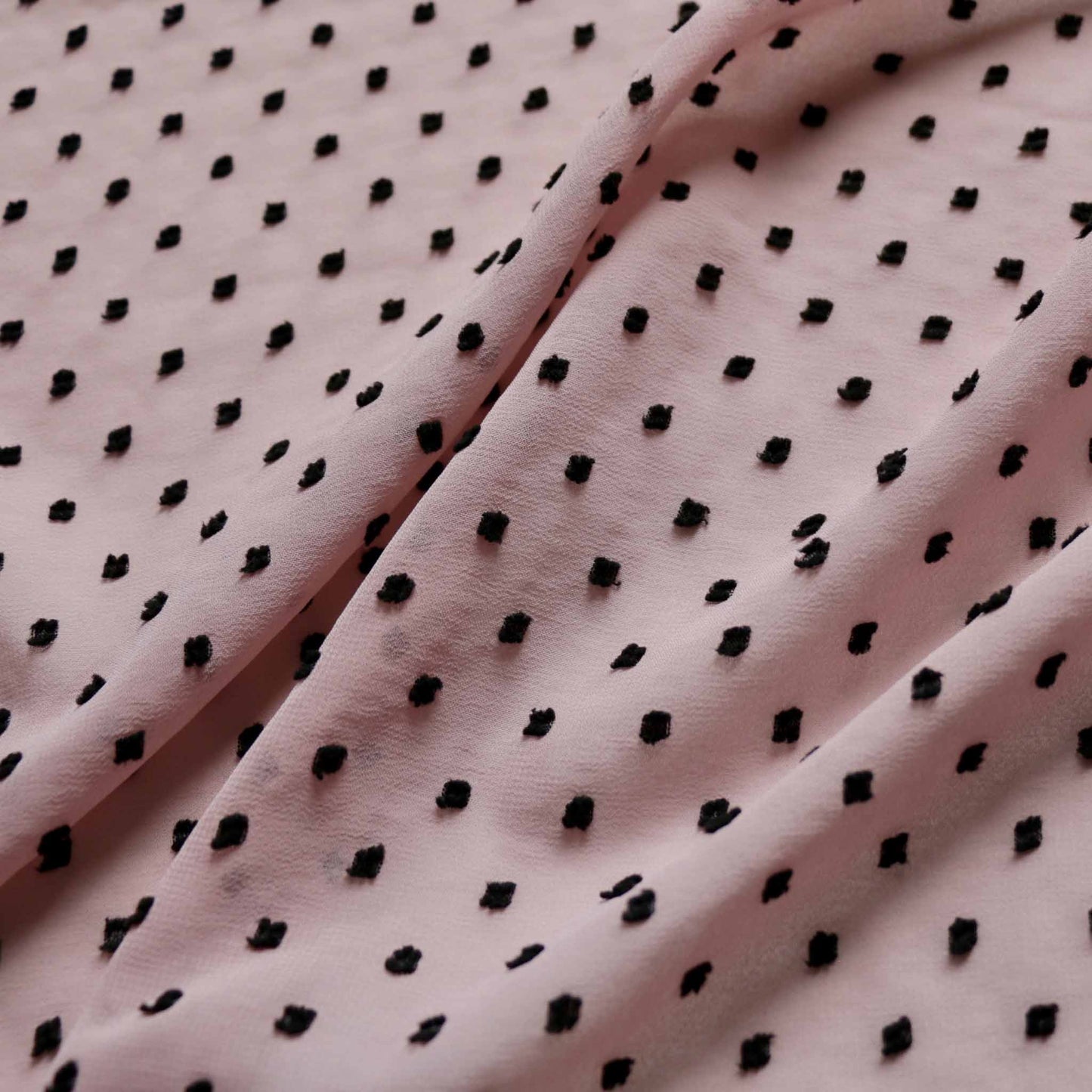 swiss dot dobby chiffon dressmaking fabric in pink with black dots