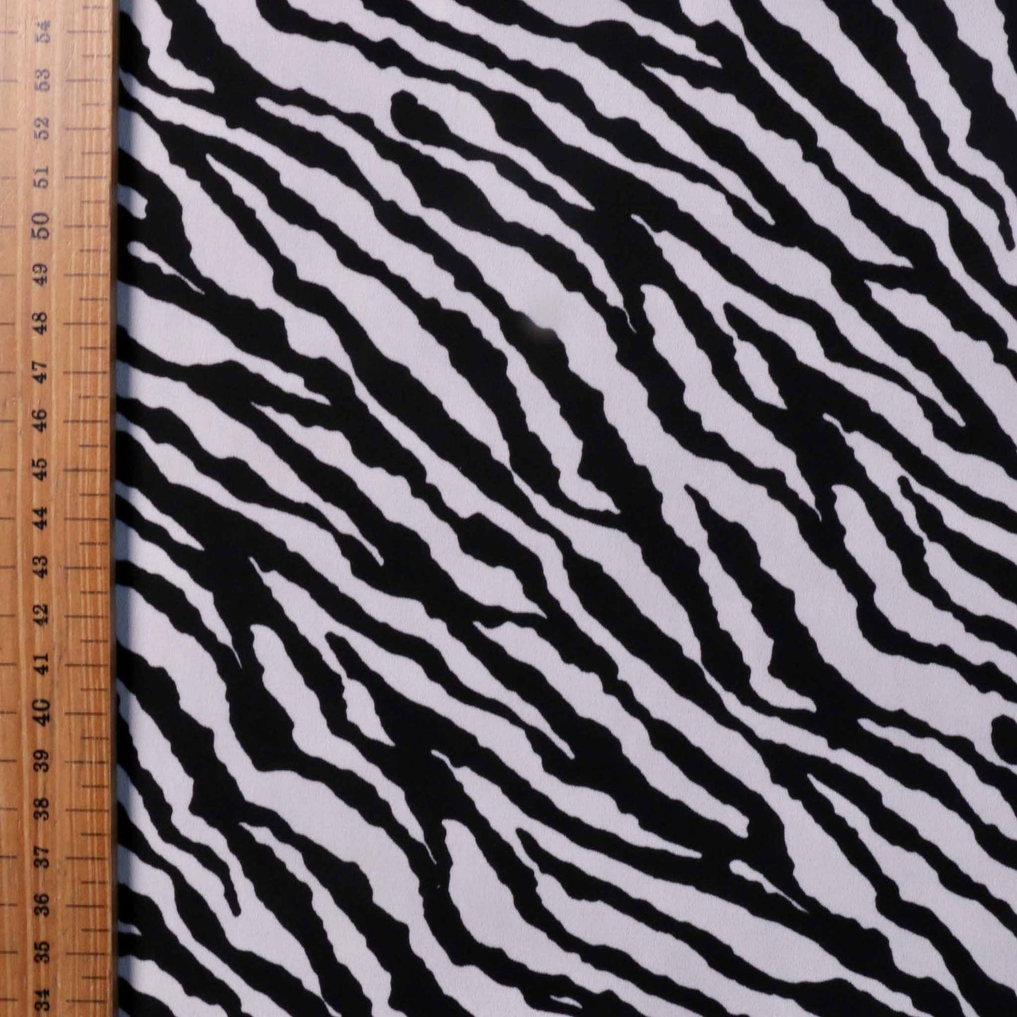 metre zebra print georgette fabric for dressmaking in black and white