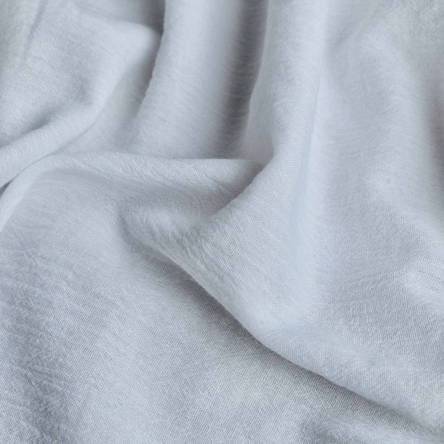 white cotton gauze dressmaking fabric with crinkle effect texture