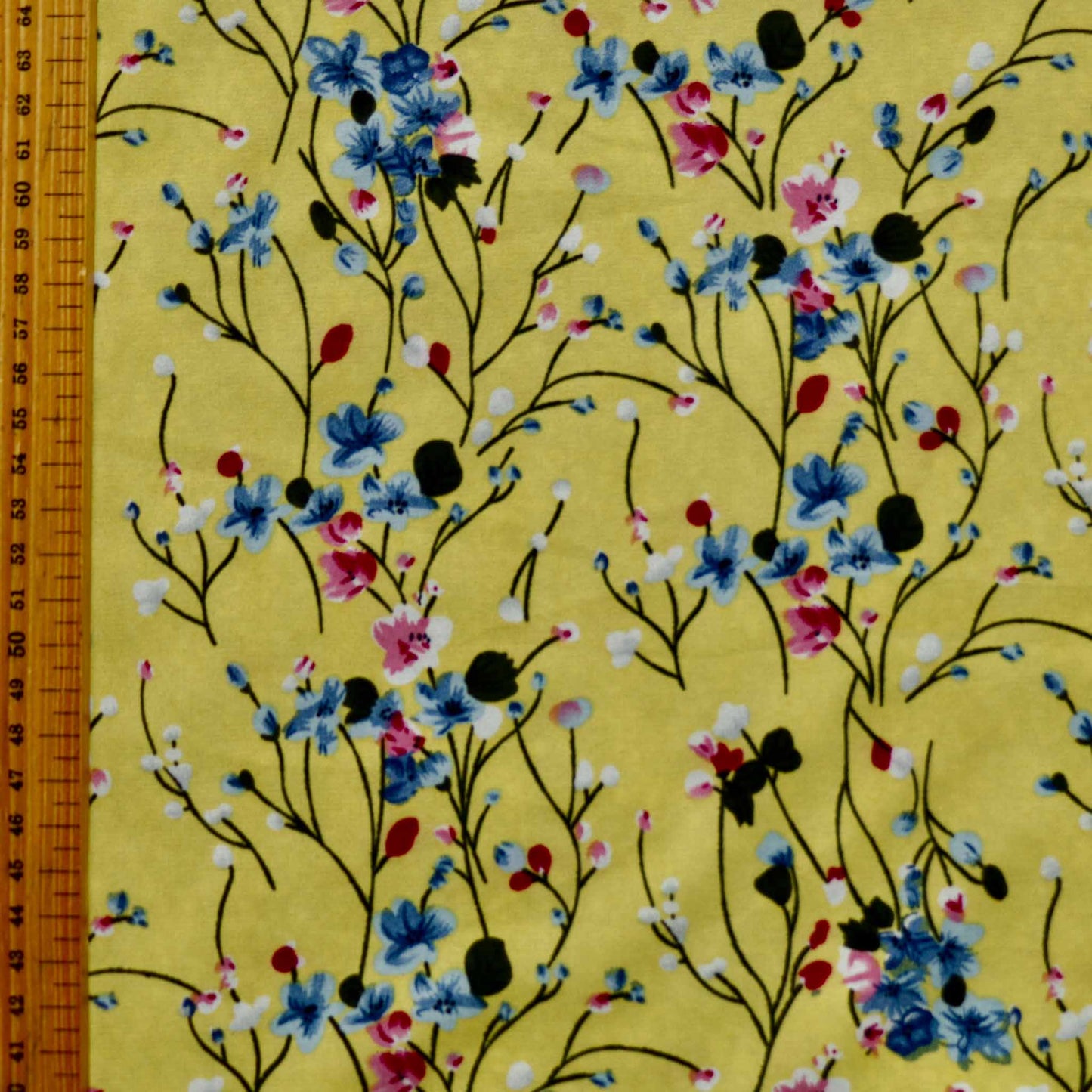 metre chiffon polyester floral dressmaking fabric with yellow black and blue flowers
