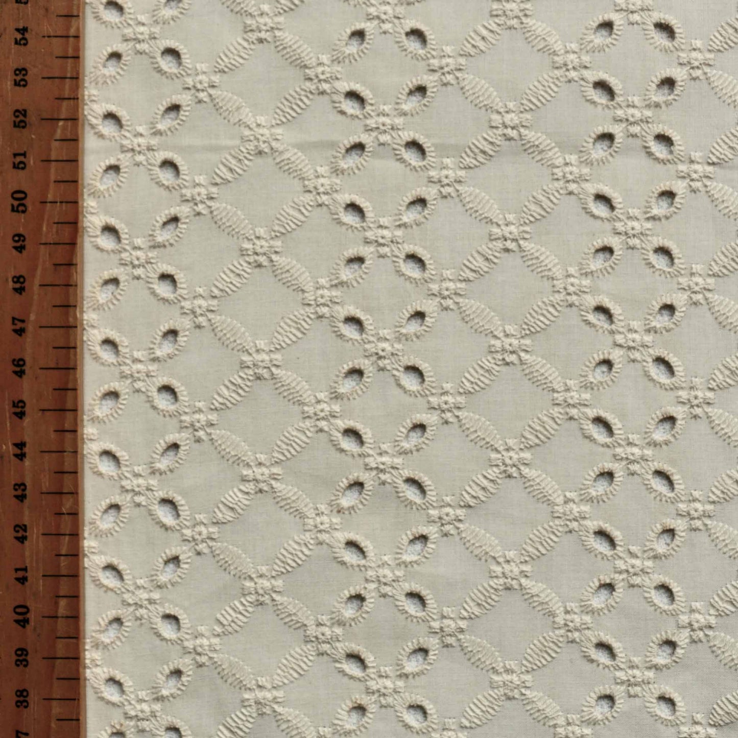 metre ivory broad anglaise 4 hole dressmaking fabric