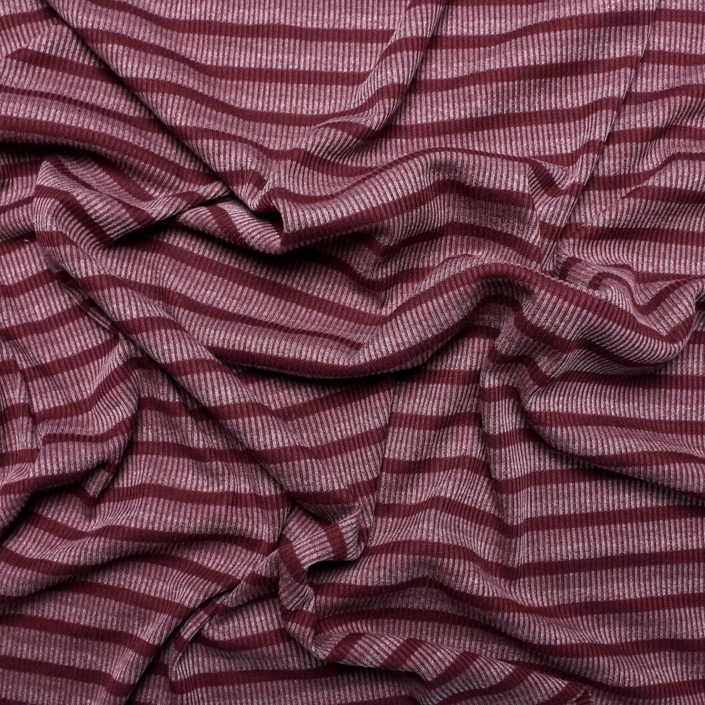 purple and mauve jersey rib striped dressmaking fabric