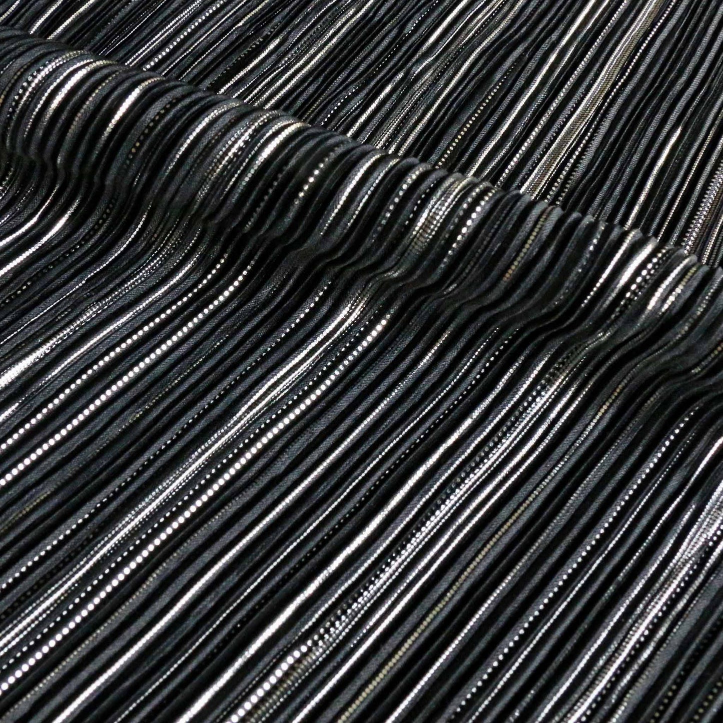 pleated silver and black plisse dressmaking fabric