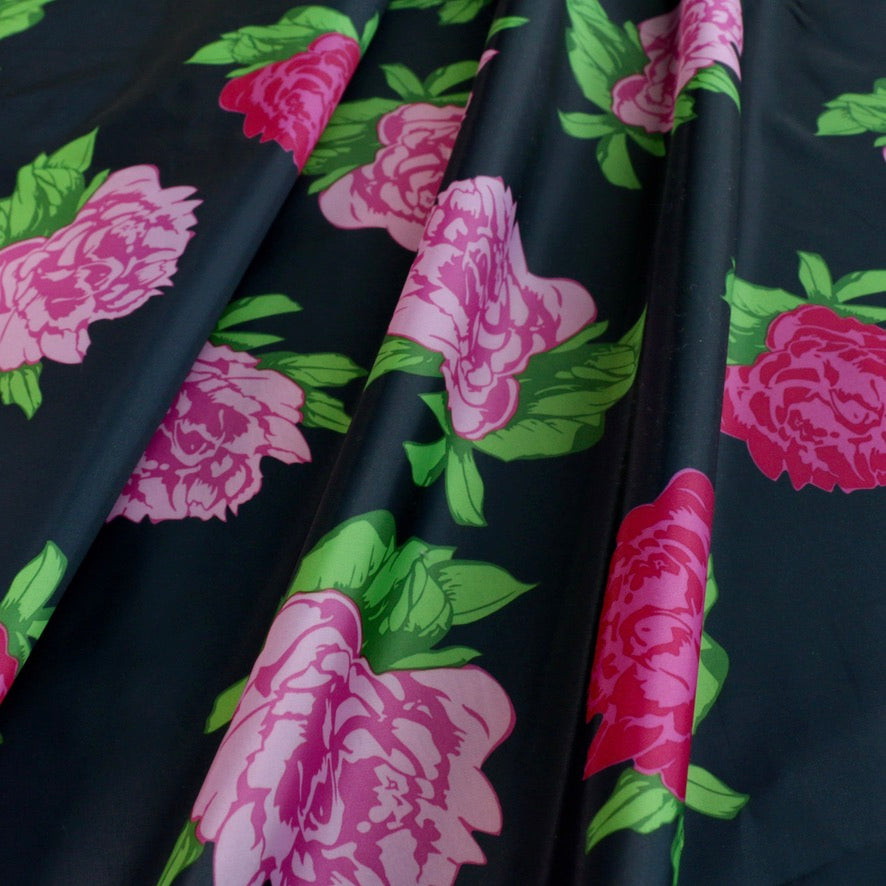 pink rose flowers printed on black lining fabric for dressmaking