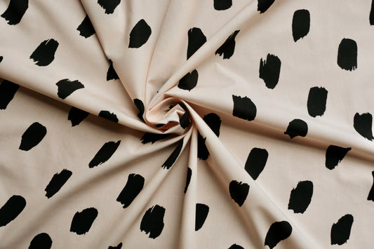 100-cotton-poplin-fabric-black-paint-brush-stroke-on-pastel-peach-clothcontrol