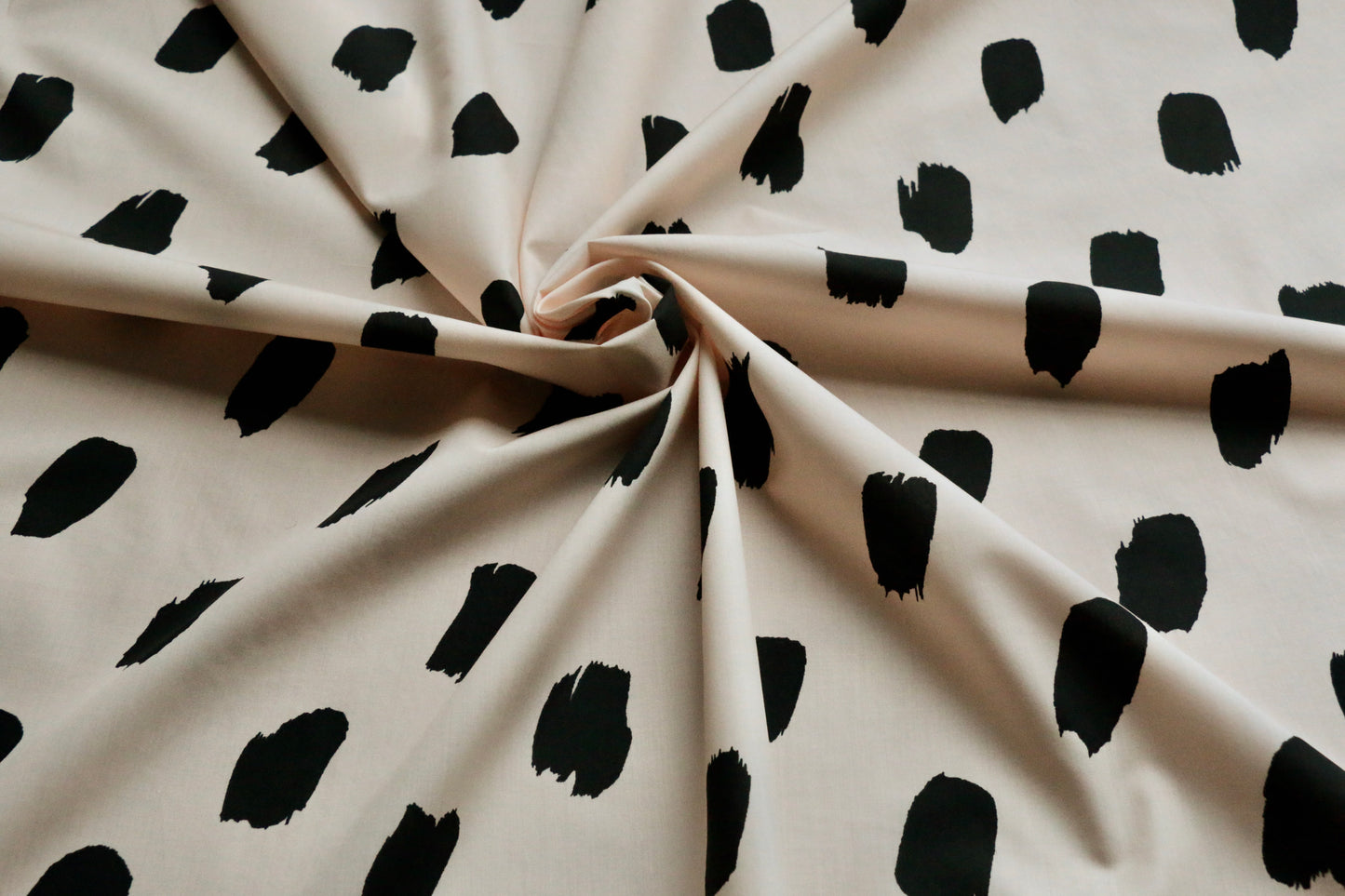 100-cotton-poplin-fabric-black-paint-brush-stroke-on-pastel-peach-clothcontrol