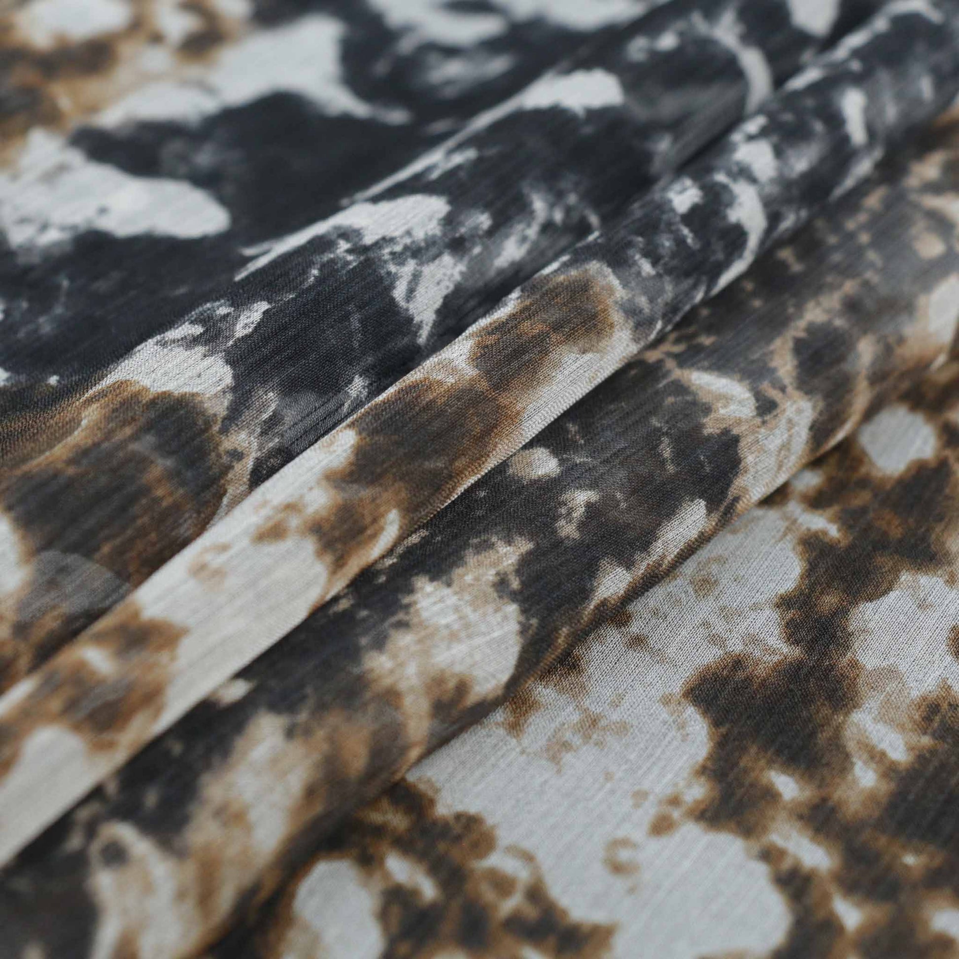 black and beige silk chiffon dressmaking fabric with animal skin print