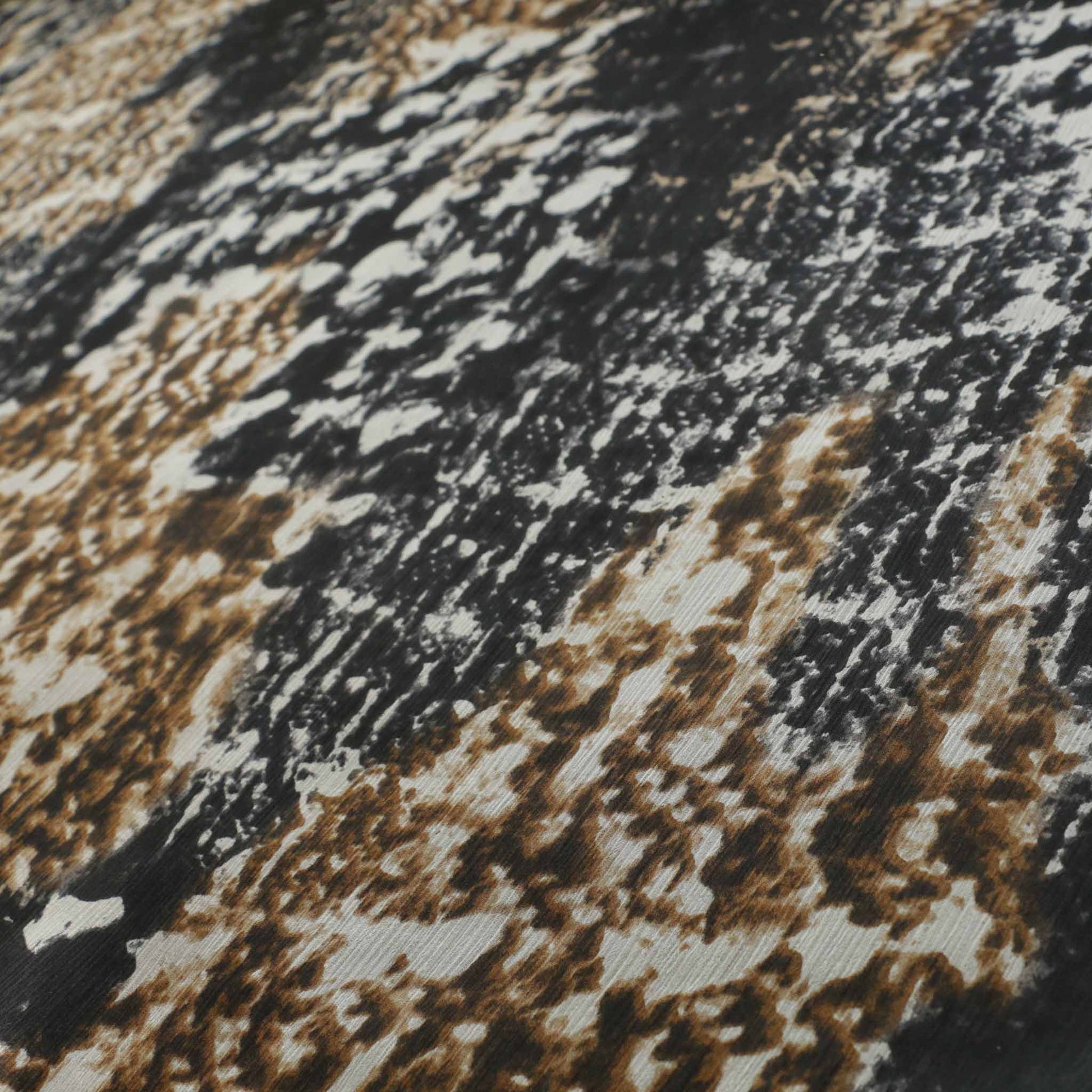 silk chiffon dressmaking fabric with beige and black animal skin print and crinkle texture