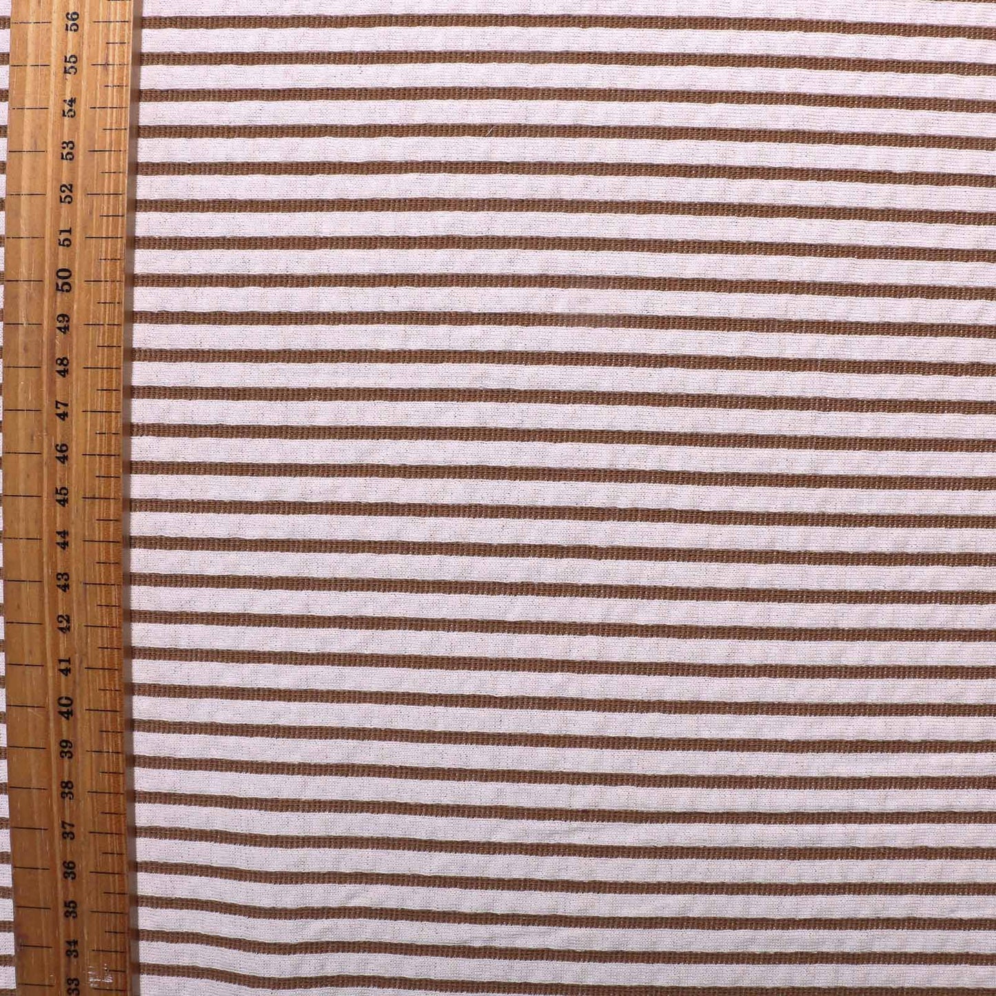 metre stretchy jersey knit acrylic dressmaking fabric in beige and white with striped pattern