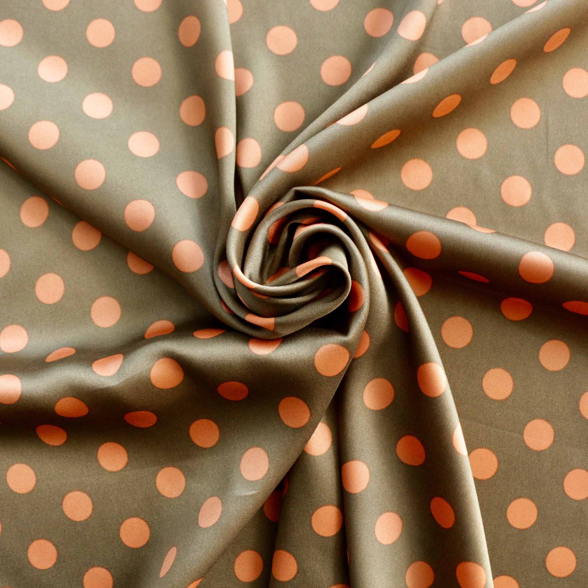 polka dot print sating dressmaking fabric in beige and peach