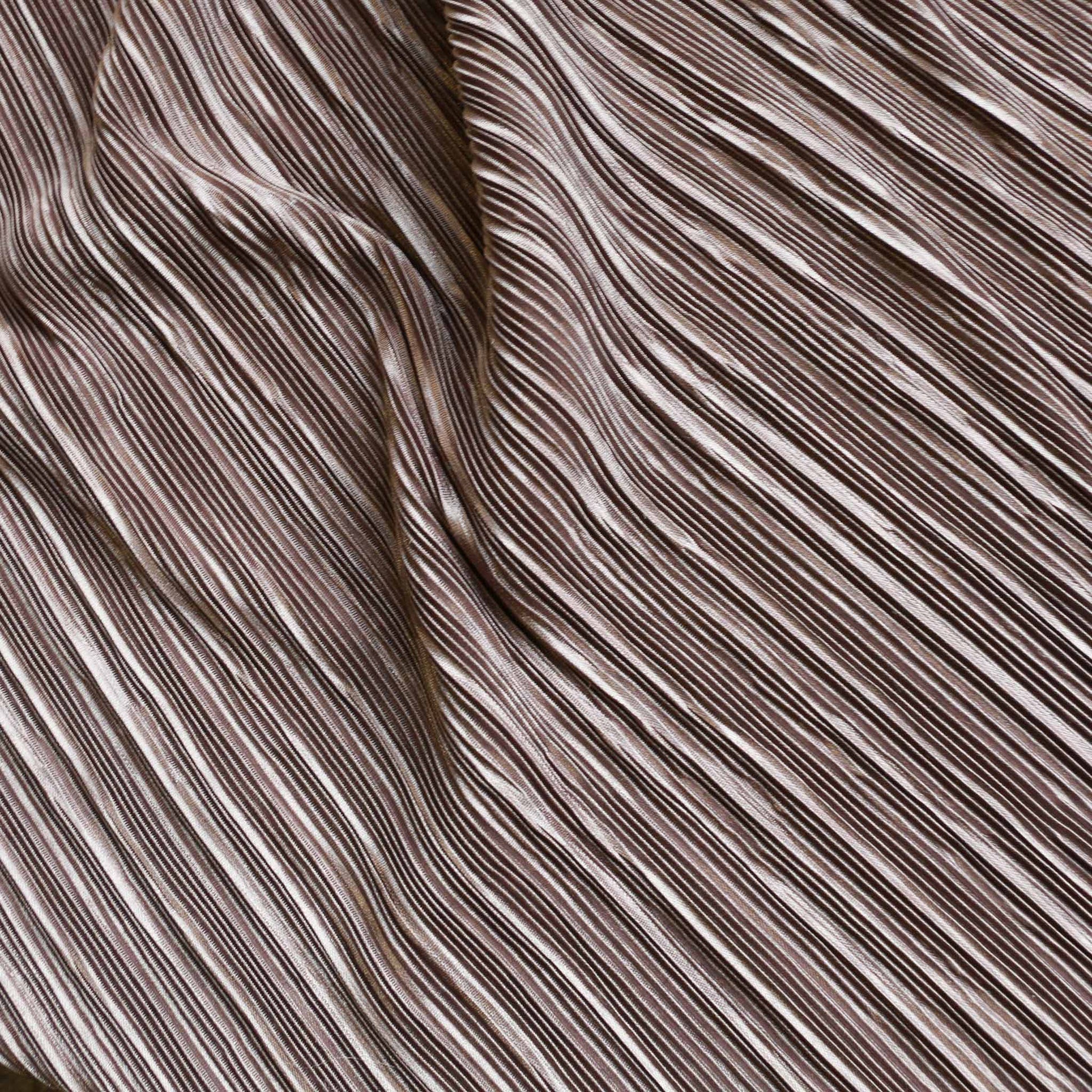 beige pleated stretchy plisse dressmaking fabric