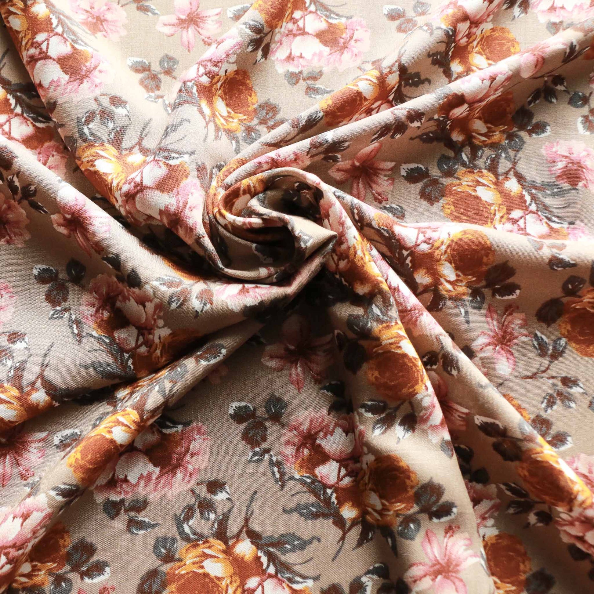 viscose challis rayon dressmaking fabric in beige grey colour with earthy orange and pink flowers printed