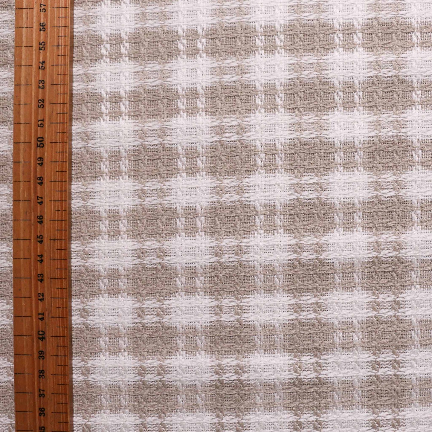 beige and white boucle dressmaking wool blend fabric with checkered pattern