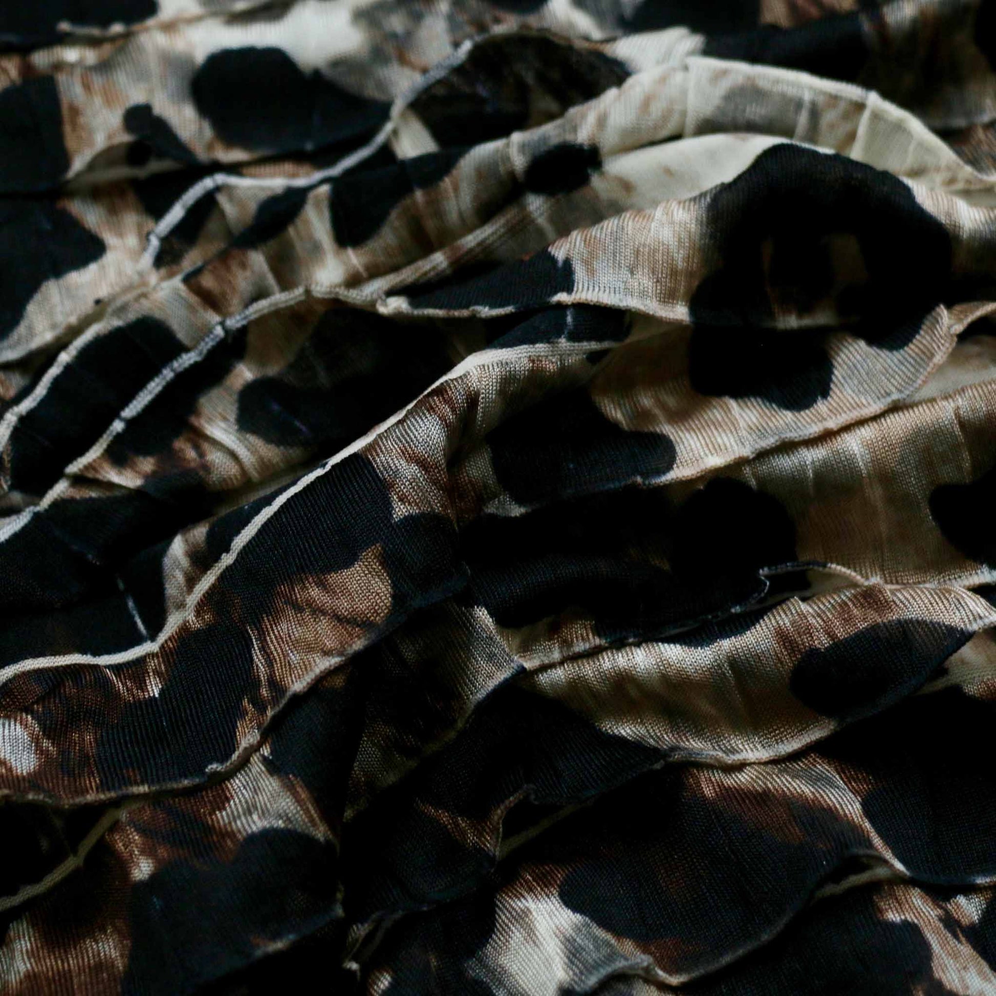 animal print ruffle rara frilly dressmaking fabric in beige and black